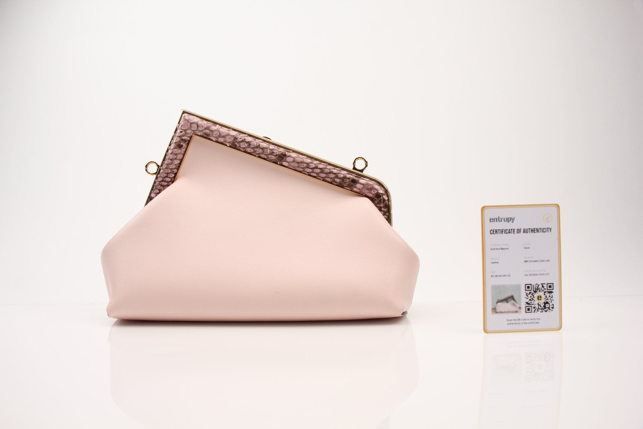 Small Fendi First clutch handbag by Gold & Beyond, with elegant design and premium leather finish.