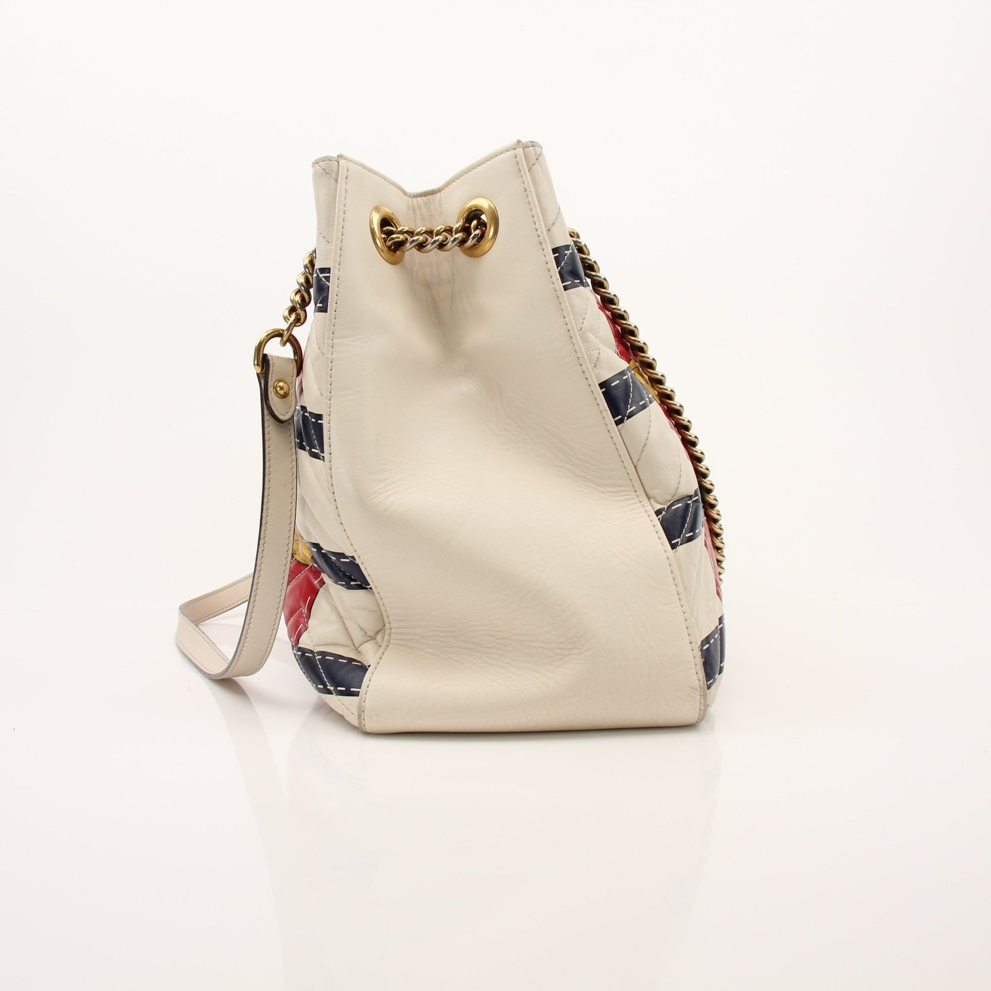 Gold & Beyond Gucci Trompe L’oeil GG shoulder handbag featuring a stylish design and woven strap, perfect for everyday use.