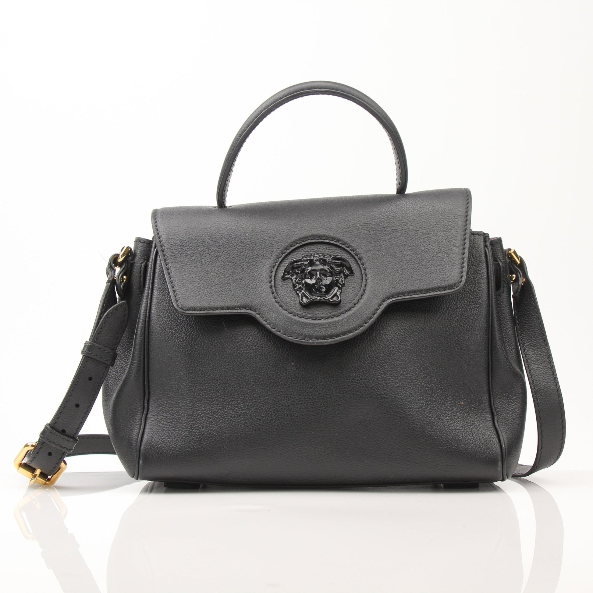 Gold & Beyond Versace La Medusa handbag with gold hardware and bold Medusa logo, stylish and luxurious accessory.