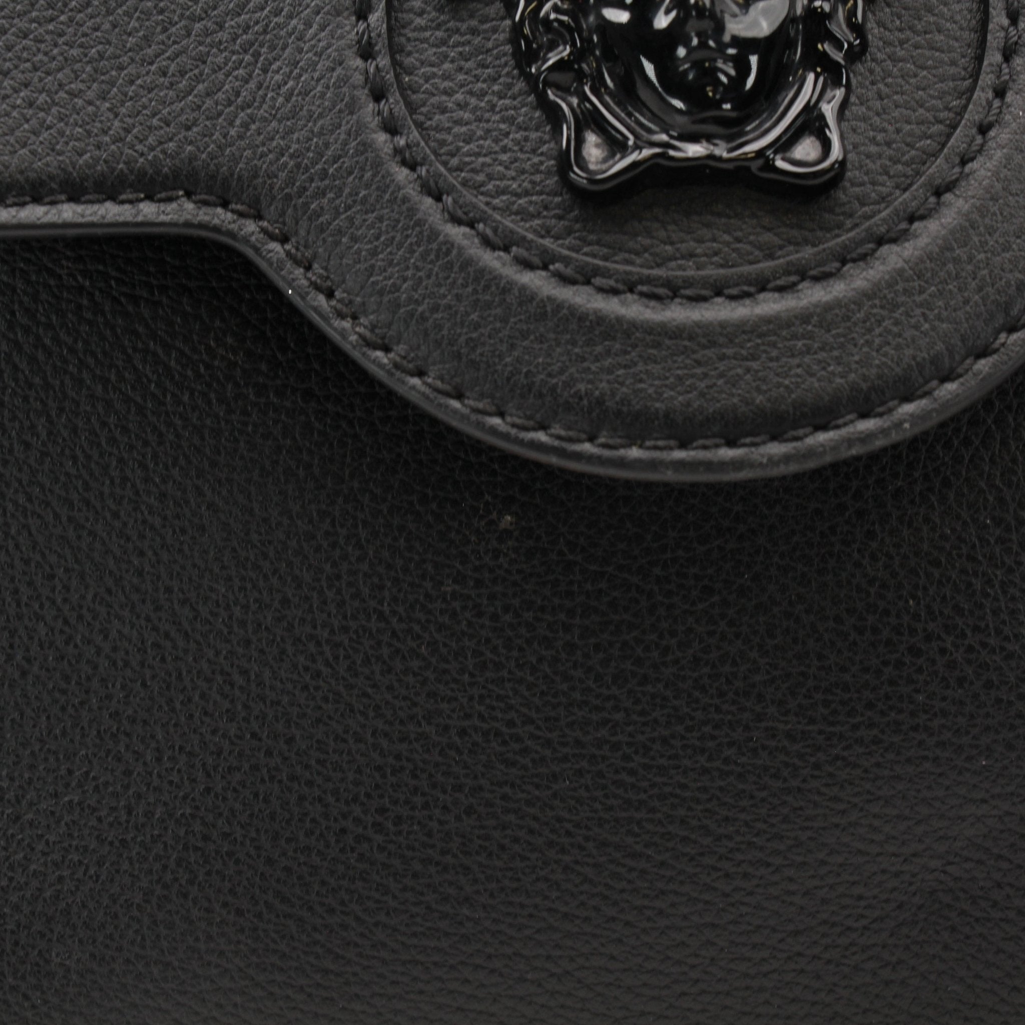 Gold & Beyond Versace La Medusa handbag with gold hardware and signature Medusa logo, stylish and elegant handbag for women.
