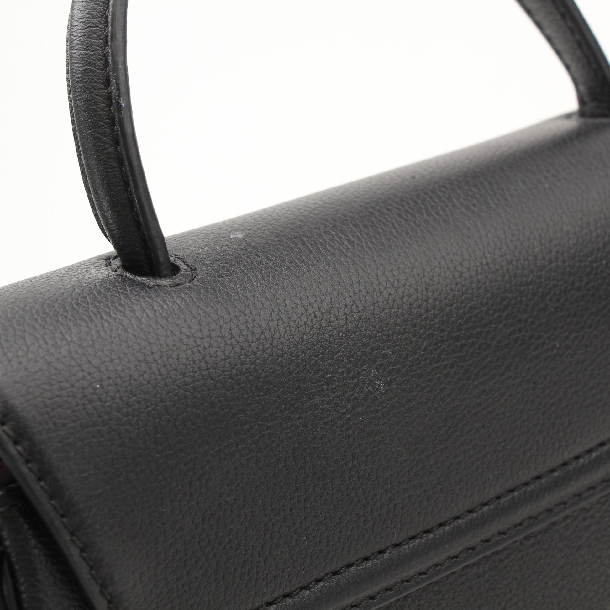 Gold & Beyond Versace La Medusa handbag with gold hardware and black leather, featuring the iconic Medusa logo on the front.