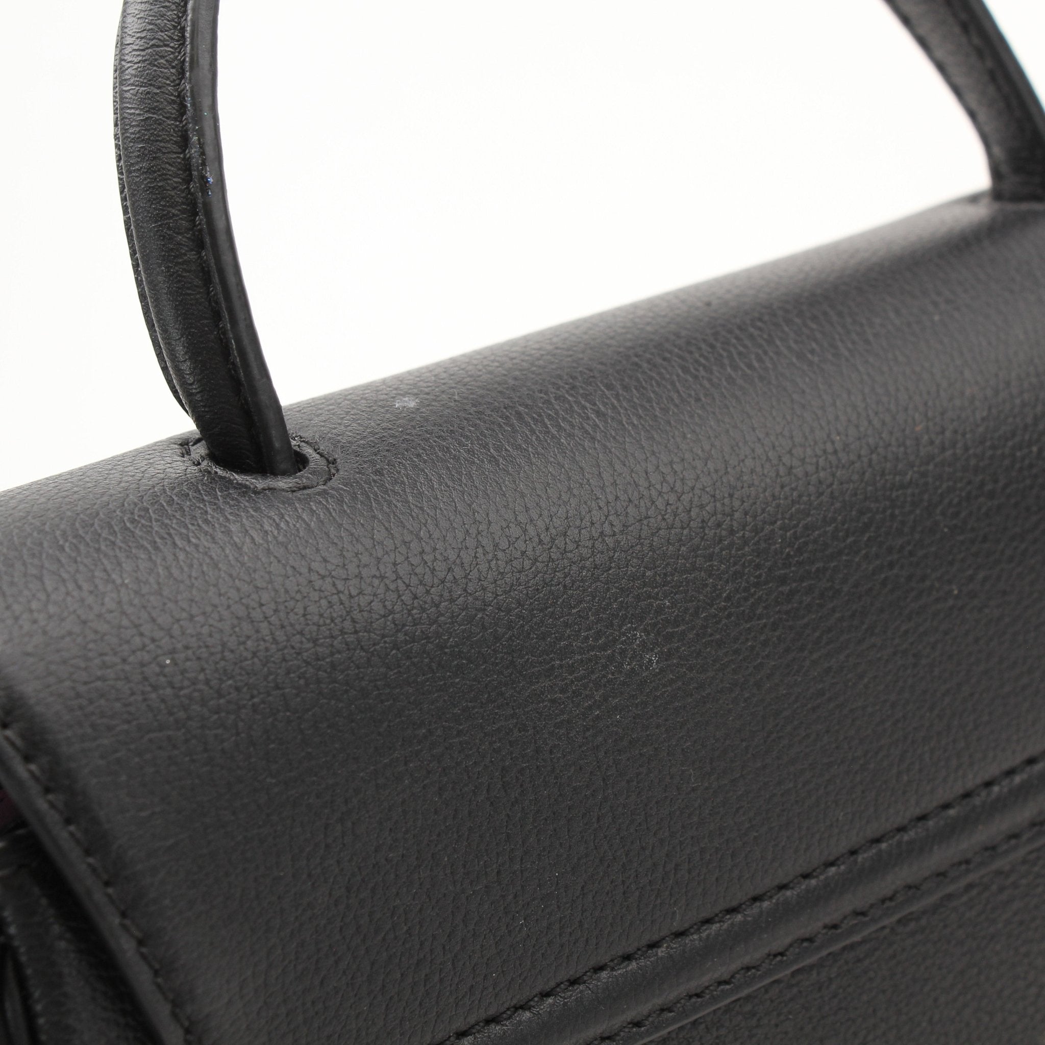Gold & Beyond Versace La Medusa handbag with gold hardware and black leather, featuring the iconic Medusa logo on the front.