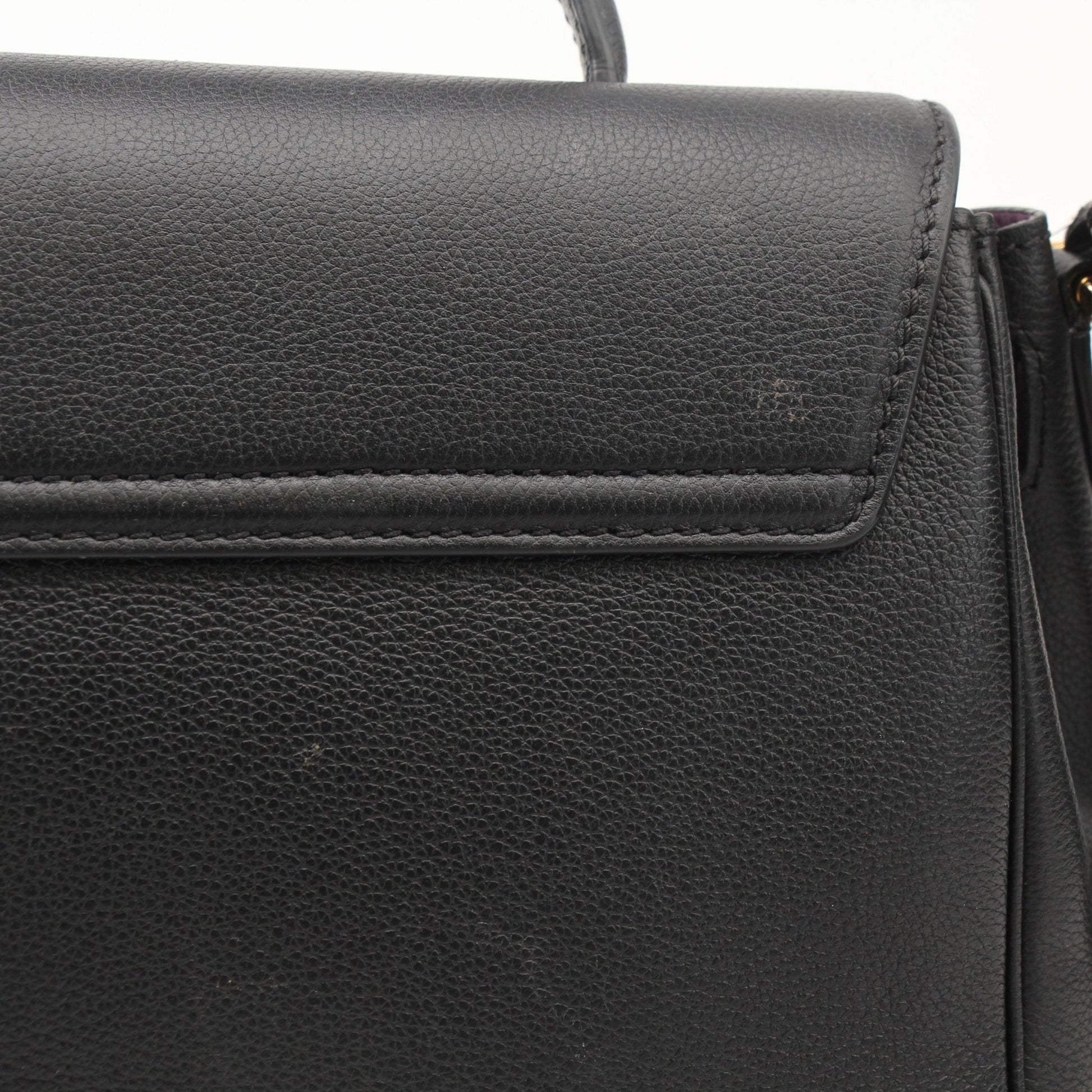 Gold & Beyond Versace La Medusa handbag with gold accents, featuring a sleek design and iconic Medusa logo on the front.