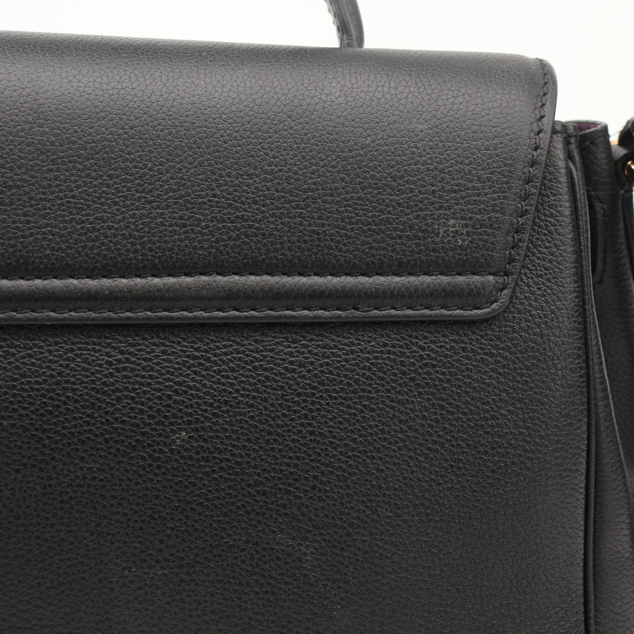 Gold & Beyond Versace La Medusa handbag with gold accents, featuring a sleek design and iconic Medusa logo on the front.