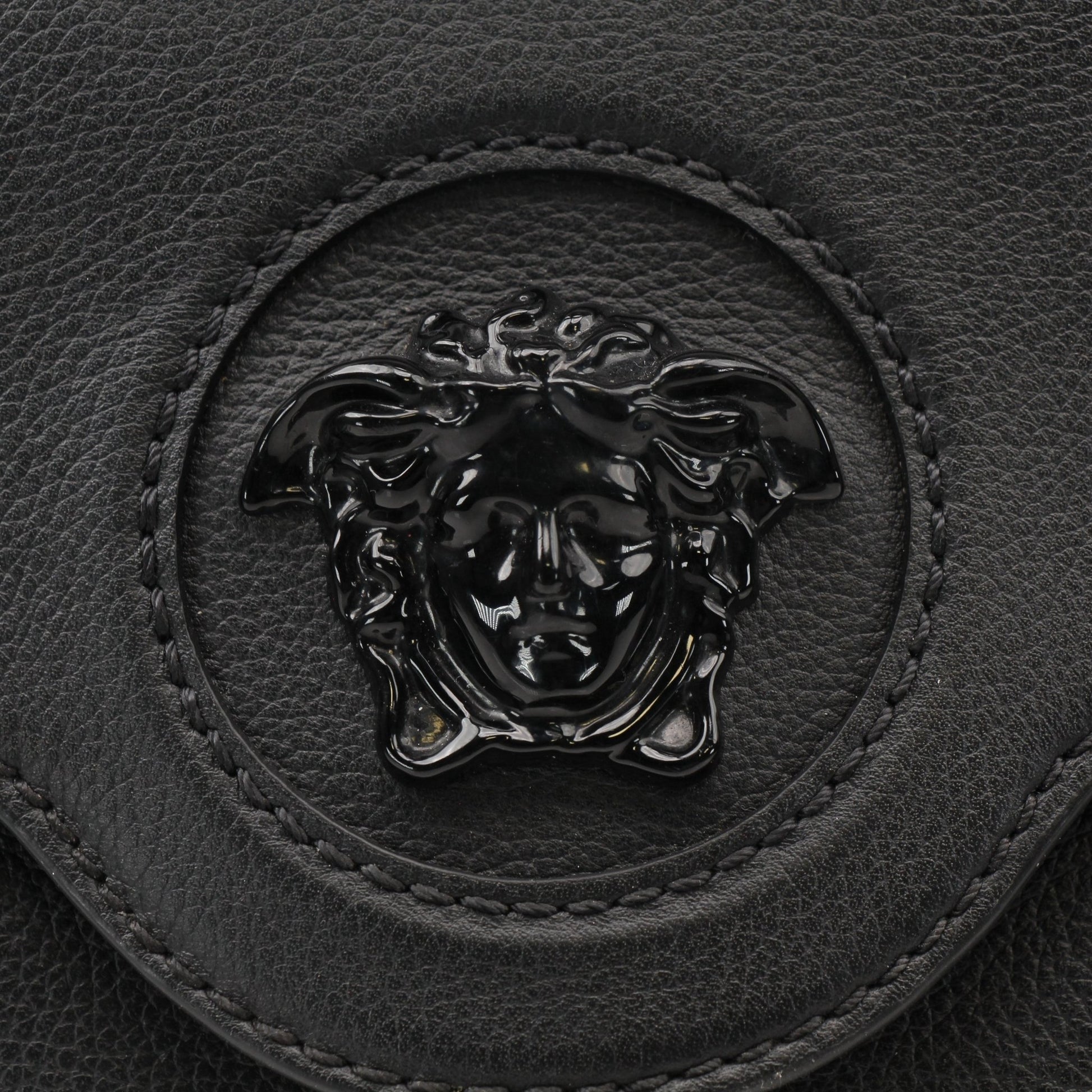 Gold & Beyond Versace La Medusa handbag featuring a luxurious design with Medusa logo and elegant gold accents.
