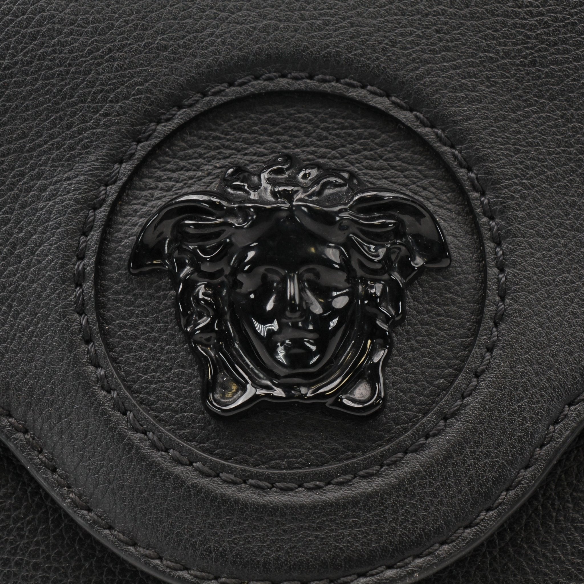 Gold & Beyond Versace La Medusa handbag featuring a luxurious design with Medusa logo and elegant gold accents.