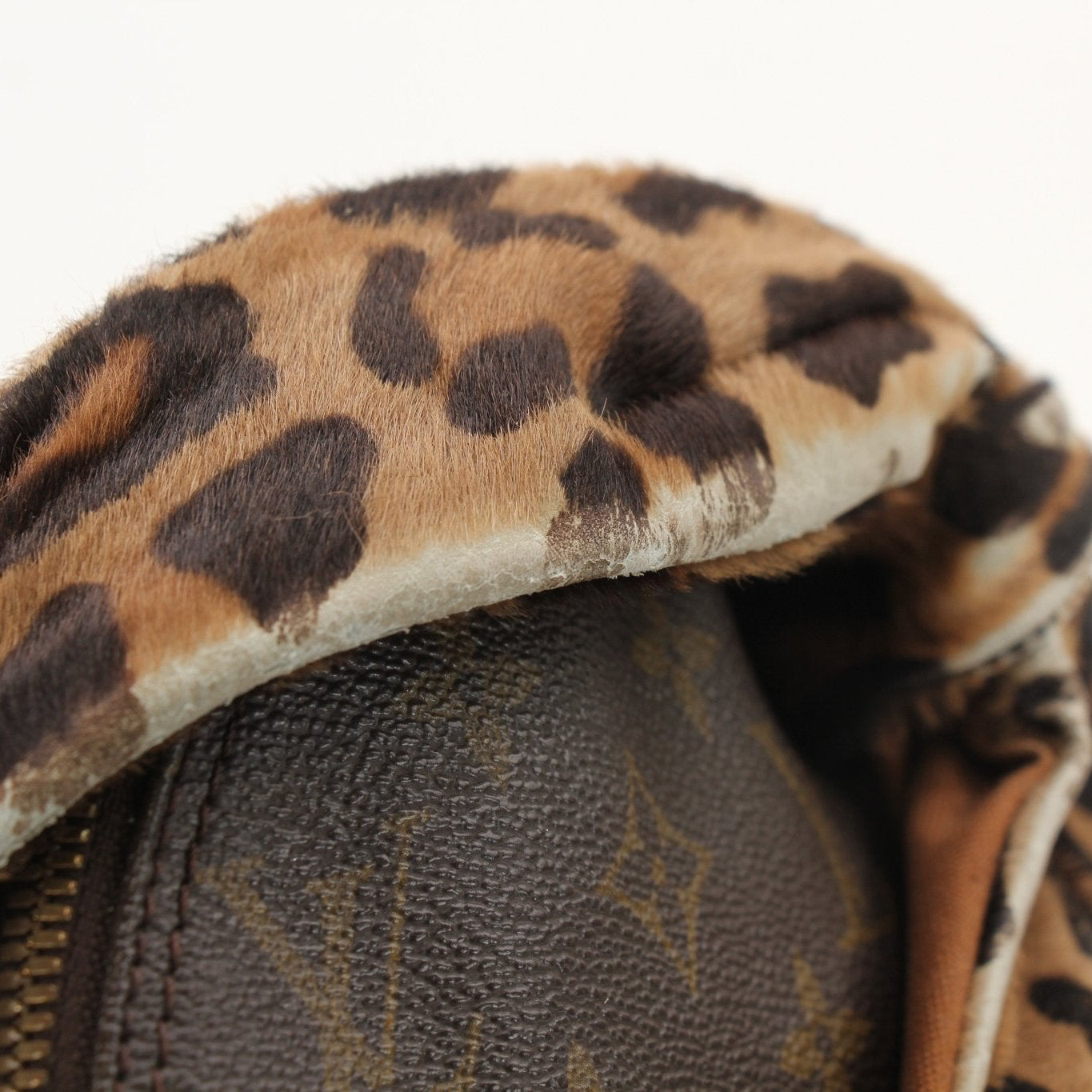 Louis Vuitton x ALAÏA designer handbag with gold accents, featuring luxurious leather and stylish hardware, by Gold & Beyond.