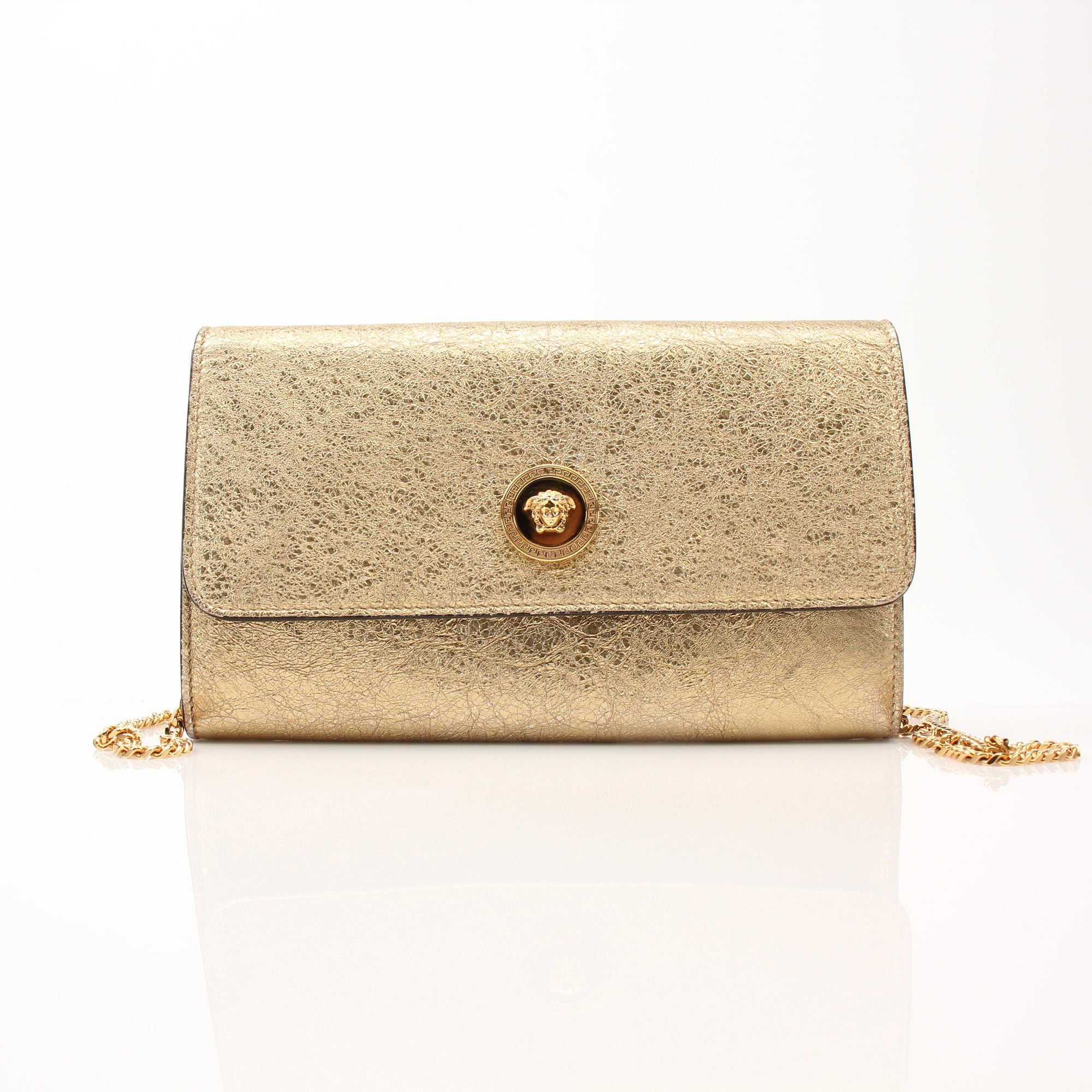 Gold & Beyond Versace Medusa flap chain wallet with gold hardware and textured design, featuring a prominent Medusa emblem on the flap.