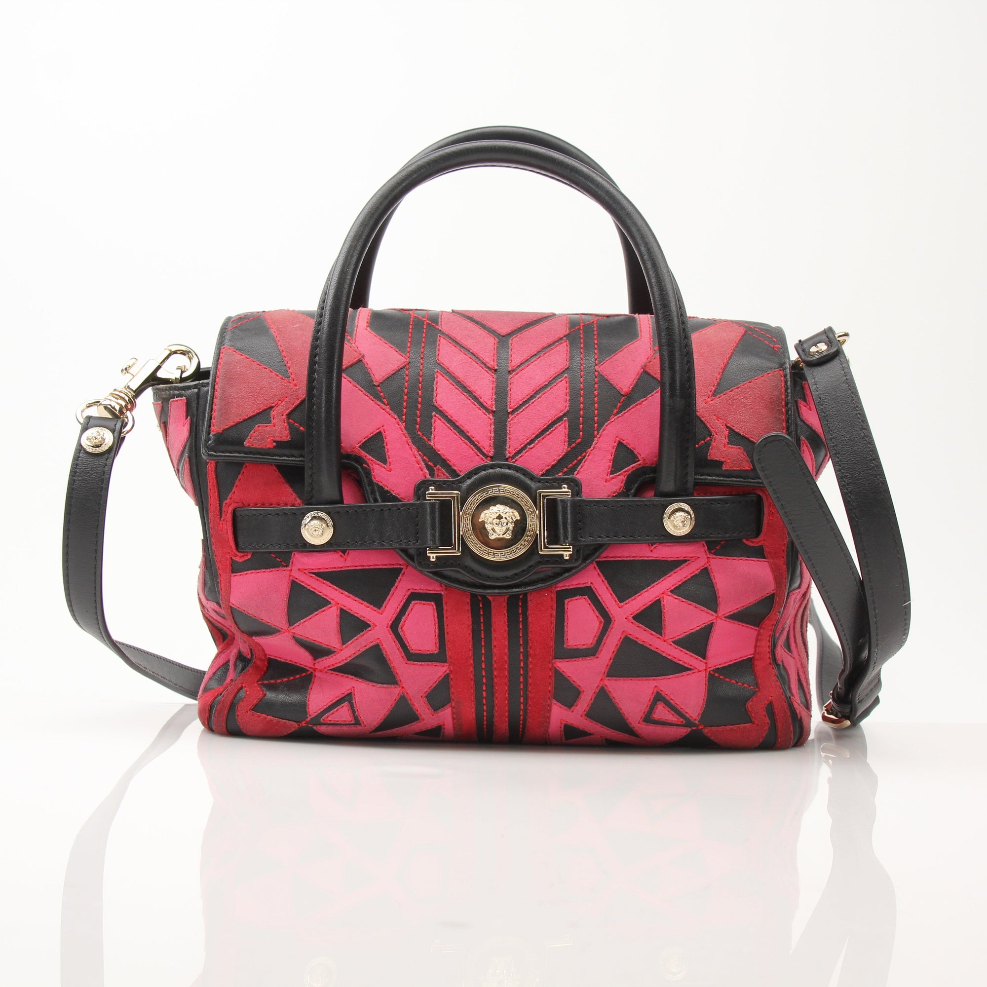 Gold & Beyond Versace patchwork crossbody handbag with multicolor design, featuring the iconic Versace pattern and adjustable strap.