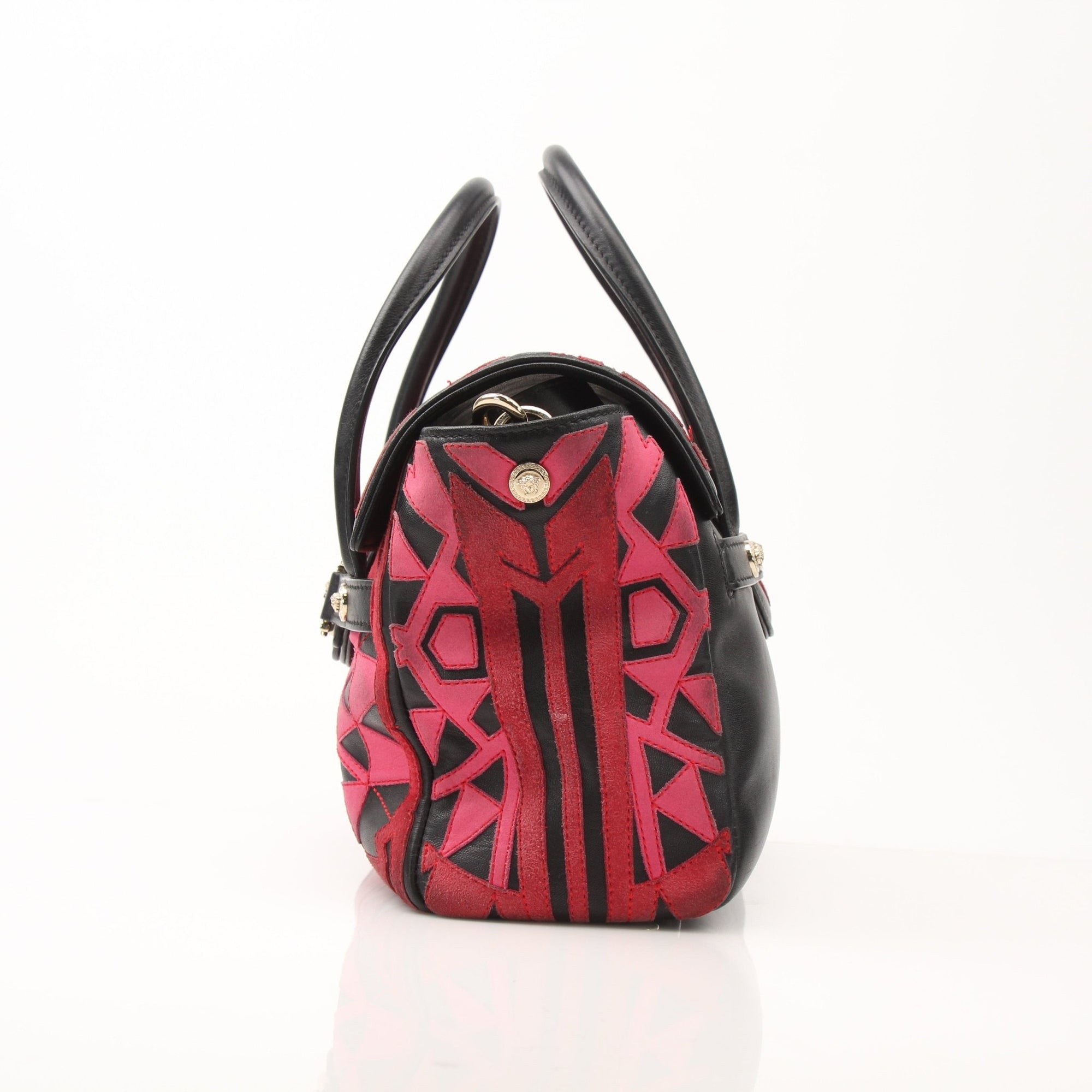 Gold & Beyond Versace patchwork crossbody handbag with adjustable strap and bold designer pattern, stylish and compact accessory.