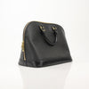 Louis Vuitton Epi Alma PM Handbag in rich color with signature design and structured silhouette, displayed against a neutral background.