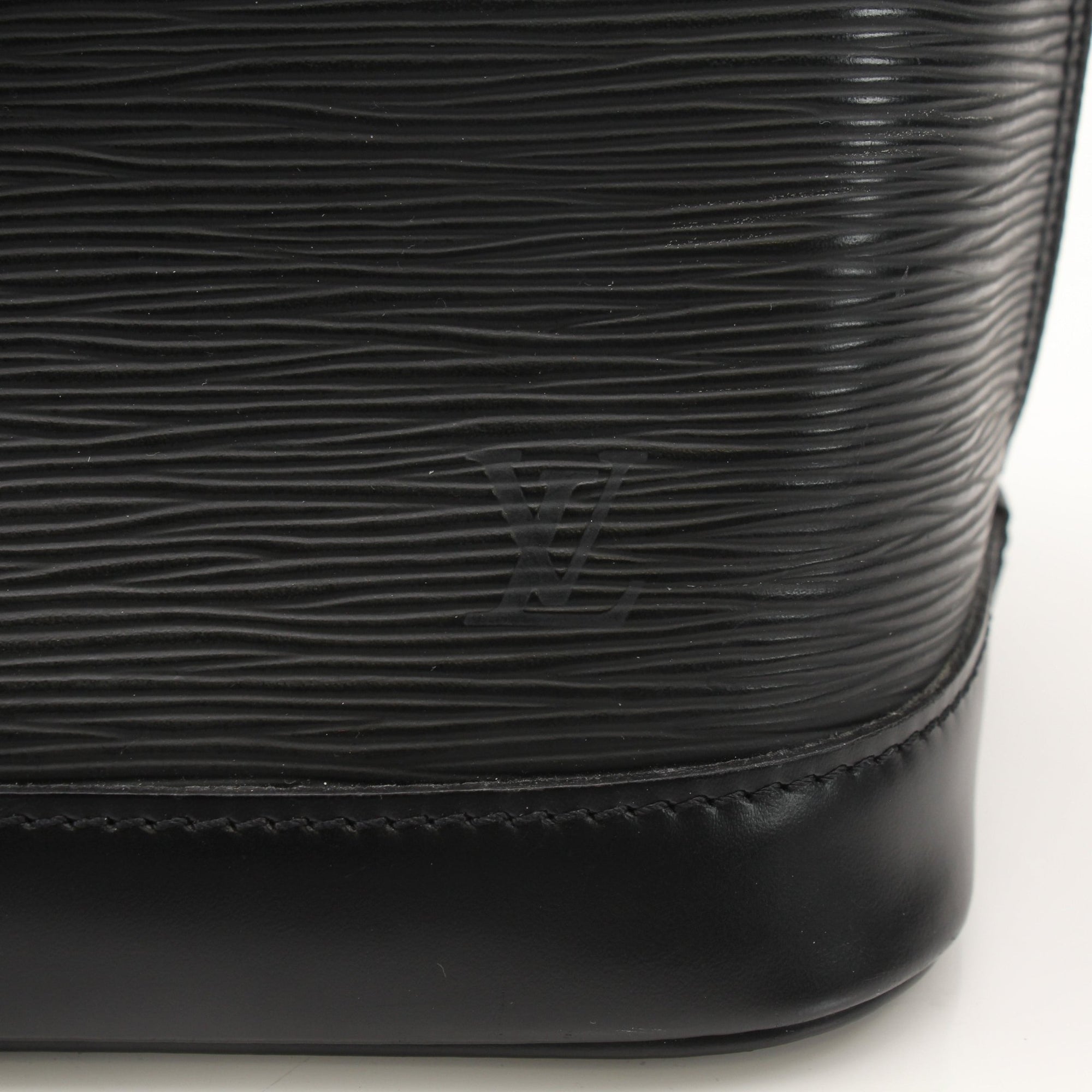 Louis Vuitton Epi Alma PM handbag in deep blue leather with a structured silhouette and gold-tone hardware.