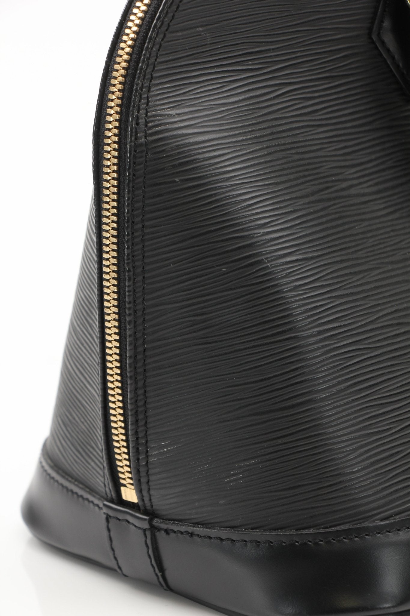 Louis Vuitton Epi Alma PM handbag in classic black leather with gold-tone hardware and structured silhouette.