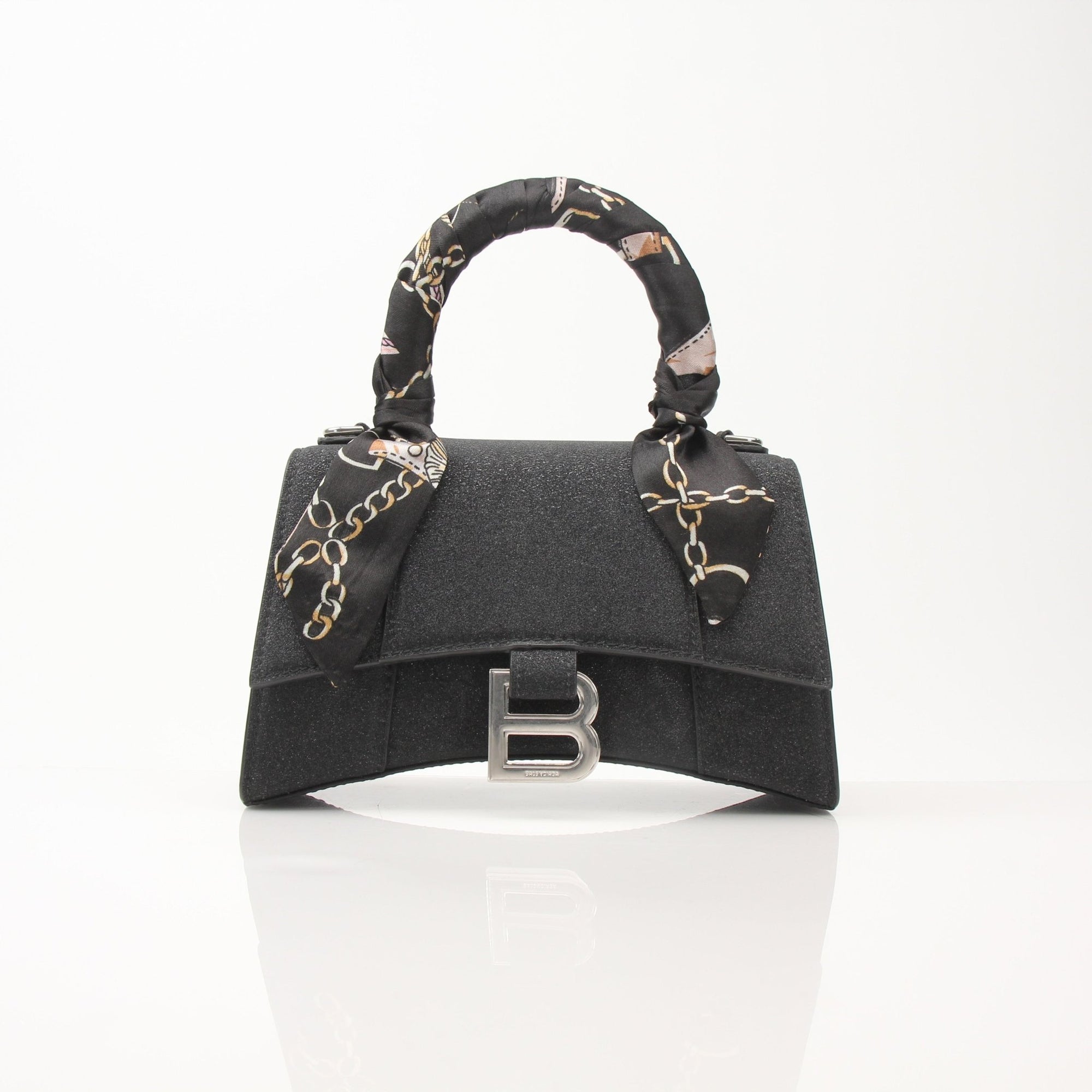 Gold & Beyond Balenciaga Hourglass XS handbag with sleek design and gold hardware, showing the elegant shape and texture.