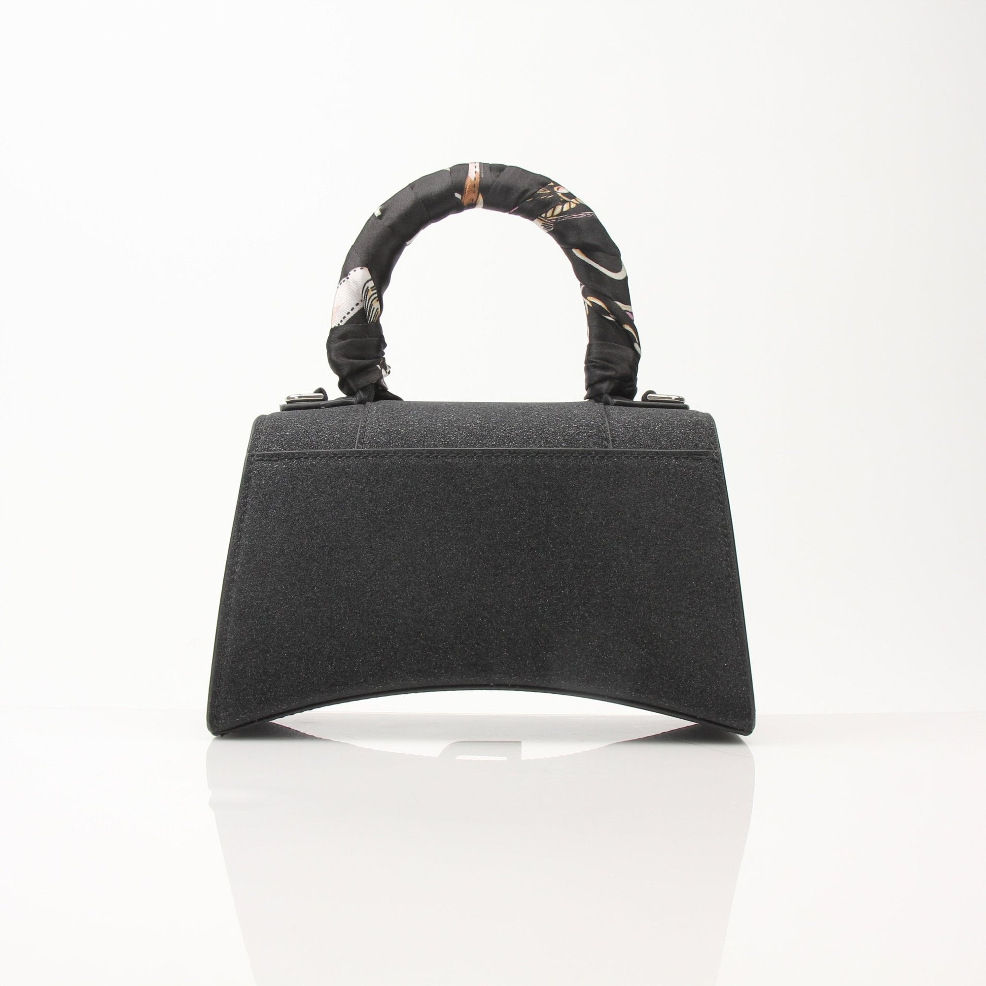 Gold & Beyond Balenciaga Hourglass XS handbag with gold hardware, featuring a sleek, structured design and top handle.