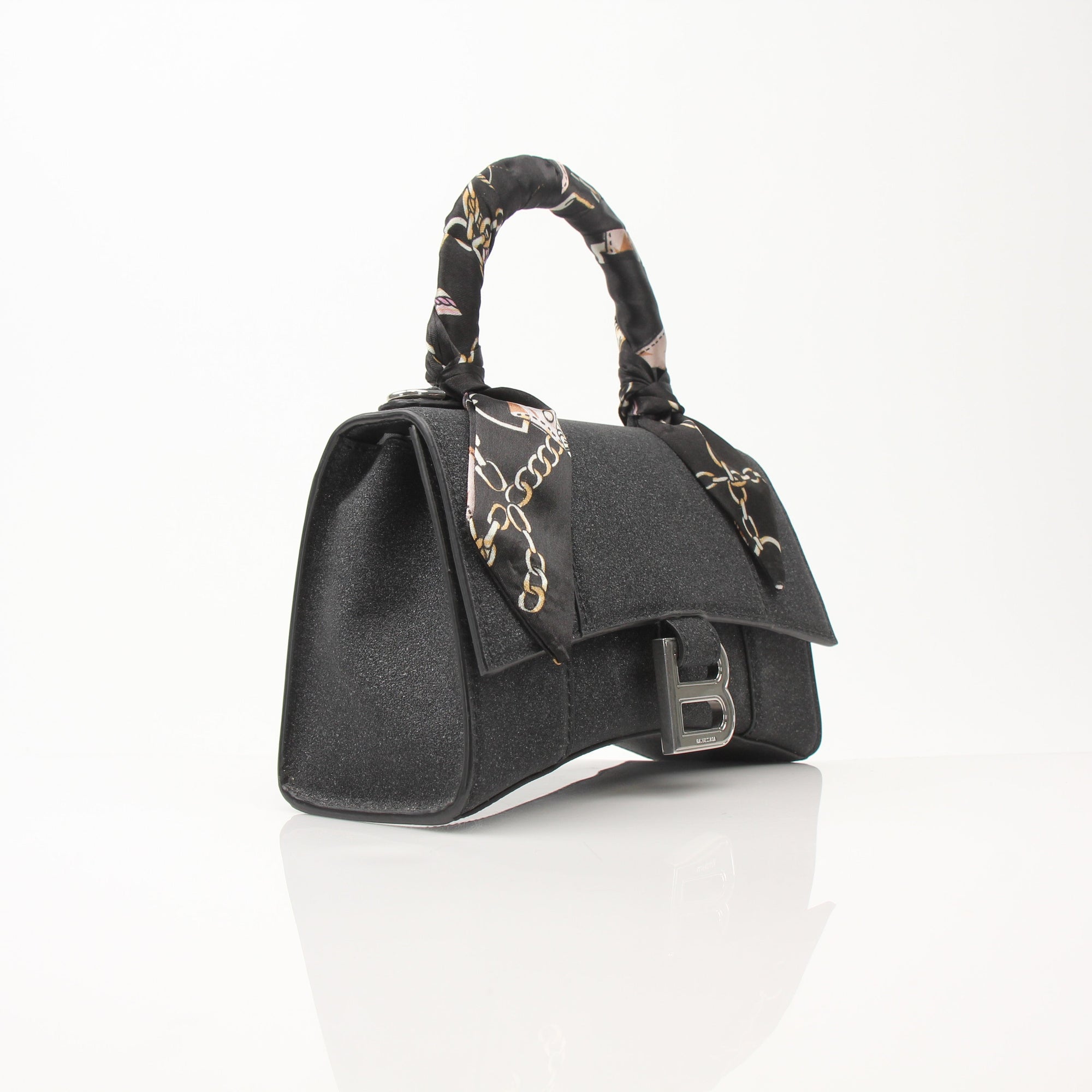 Gold & Beyond Balenciaga Hourglass XS handbag with gold hardware and sleek design, featuring a compact, elegant shape.