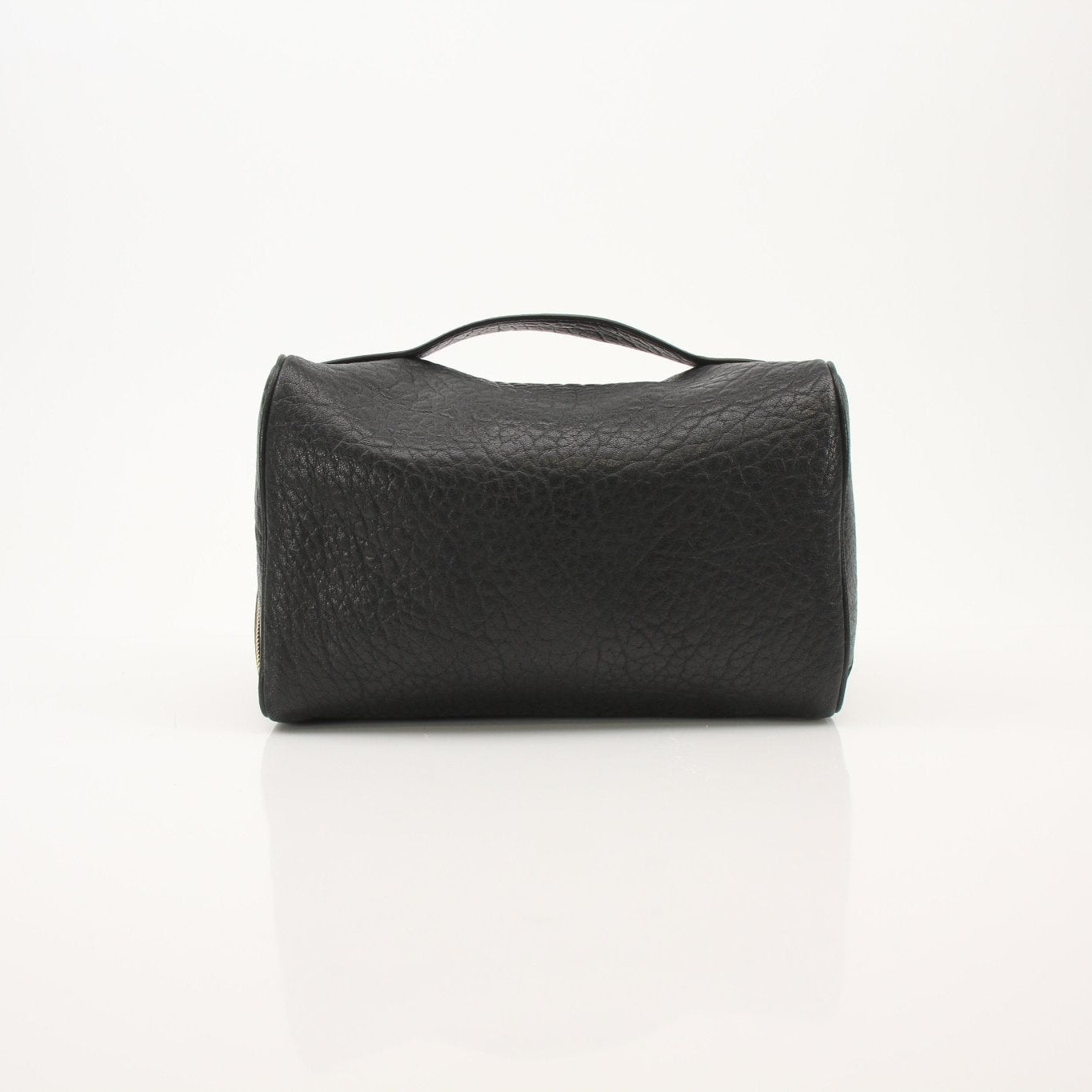 Gold & Beyond Saint Laurent vanity case with sleek design and compact storage, shown open with interior compartments.