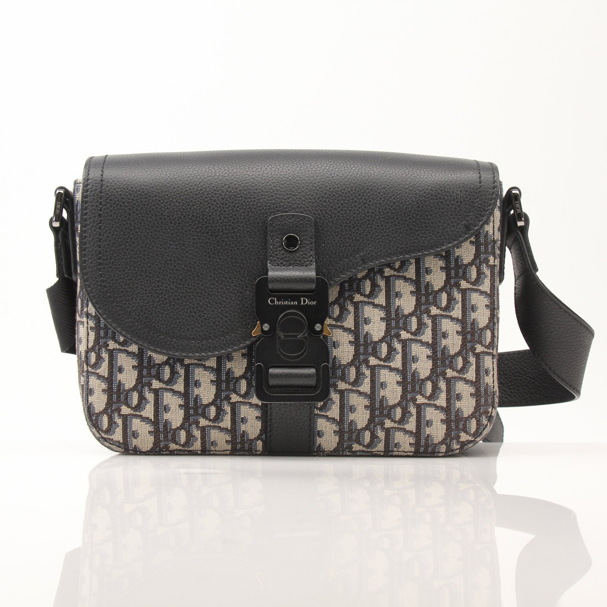 Gold & Beyond Dior Saddle Messenger handbag with signature design, featuring a structured leather body and adjustable strap.