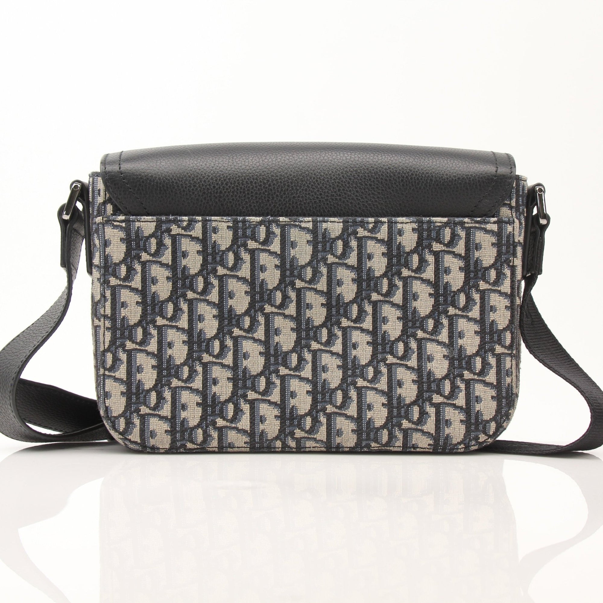 Gold & Beyond Dior Saddle Messenger handbag with adjustable strap and signature saddle design, crafted in luxurious material.