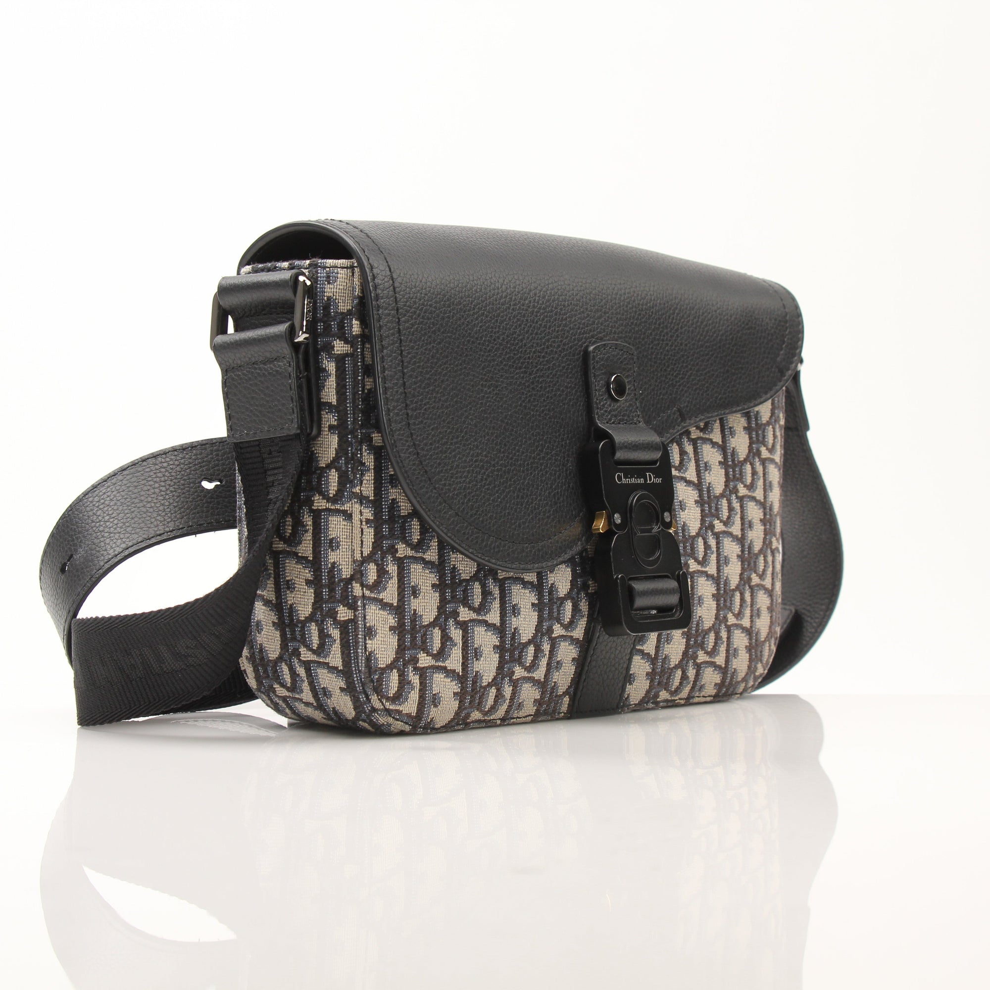 Gold & Beyond Dior Saddle Messenger handbag with structured design, featuring tan leather and signature saddle shape.