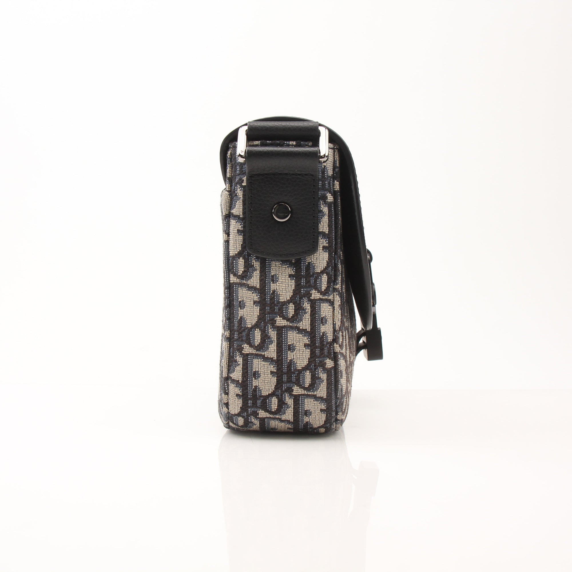 Gold & Beyond Dior Saddle Messenger handbag with adjustable strap and signature saddle design, crafted from luxurious leather.