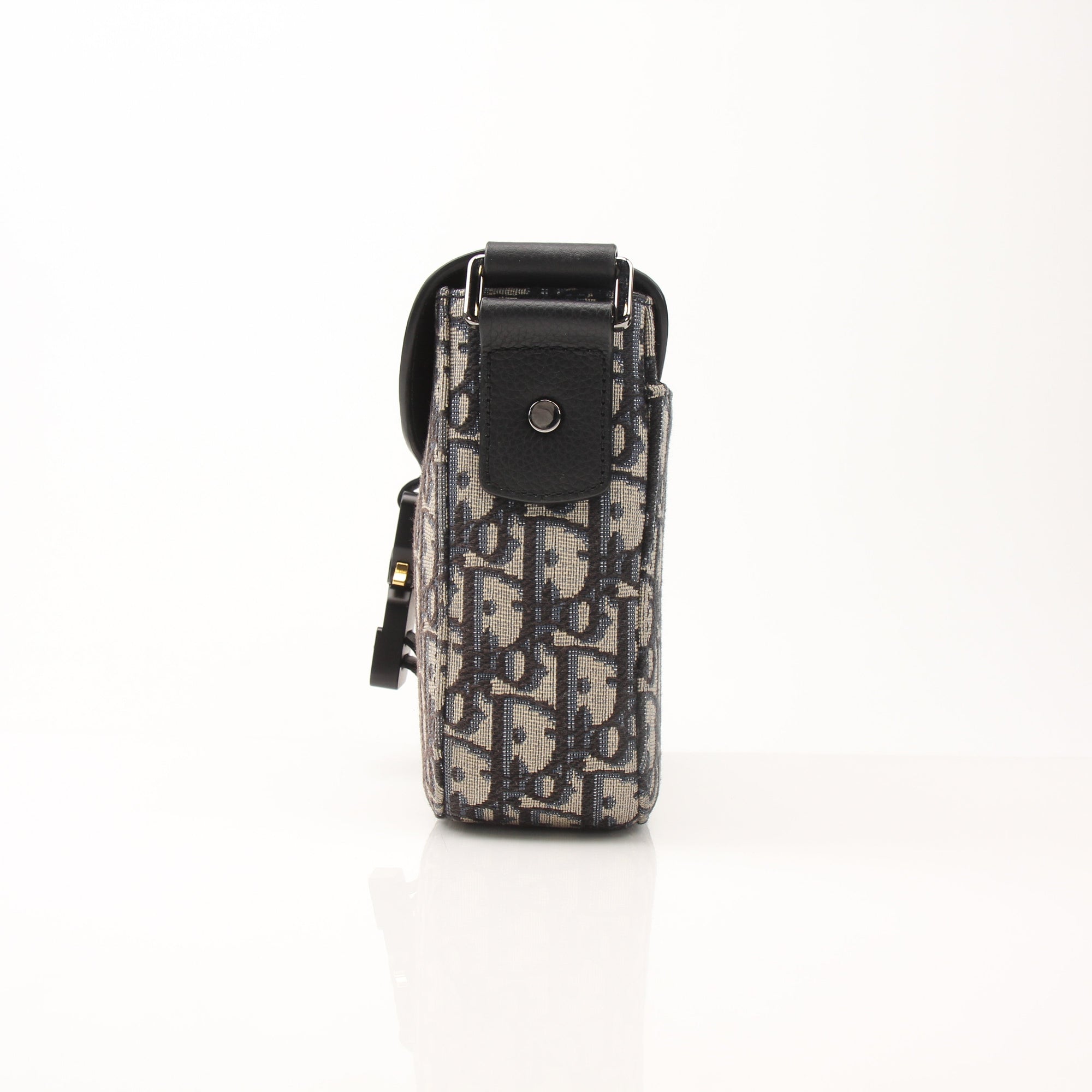 Gold & Beyond Dior Saddle Messenger handbag with tan leather and gold hardware, showcasing its stylish and structured design.