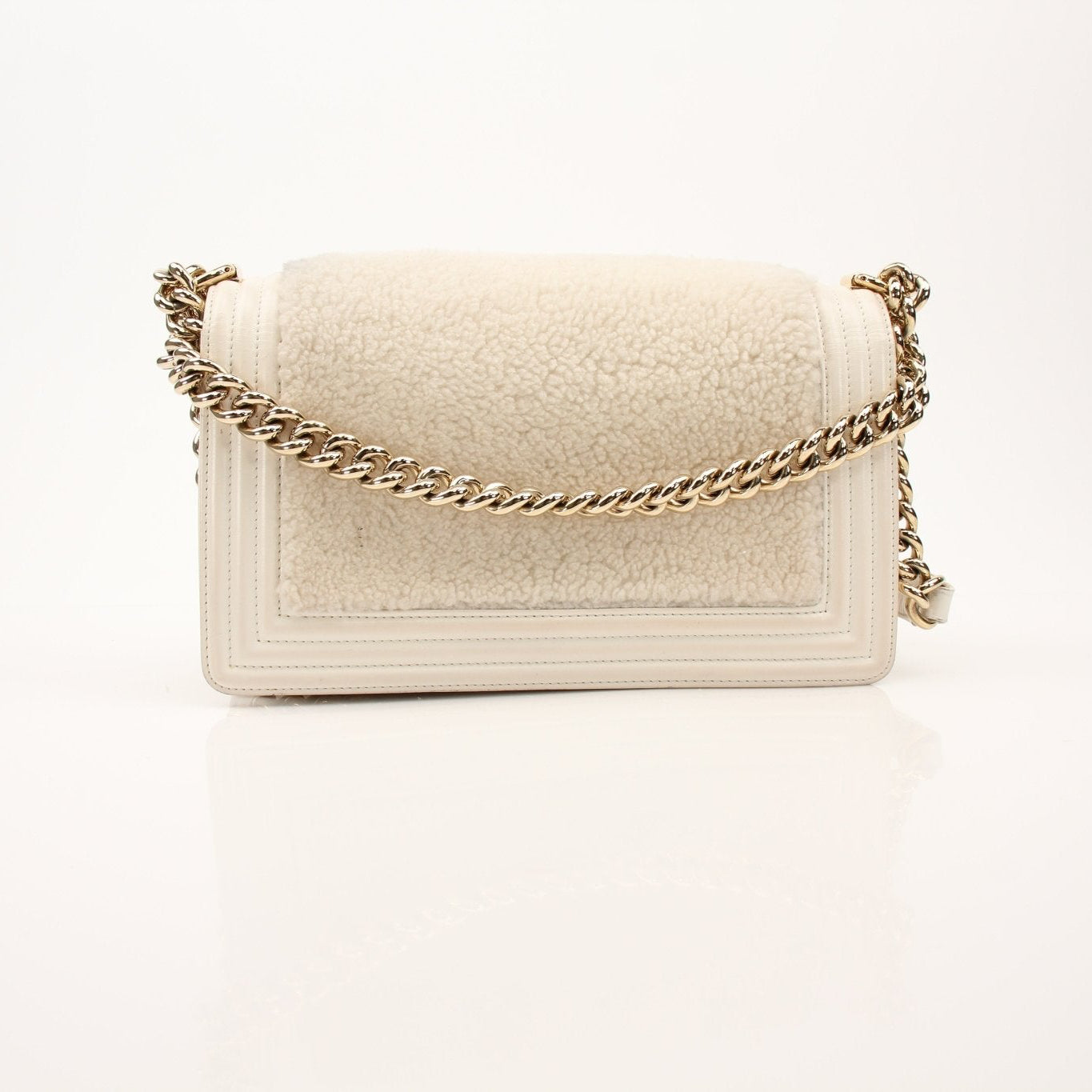 Gold & Beyond Chanel Le Boy Shoulder Bag, stylish handbag with quilted leather and chain strap, close-up view.