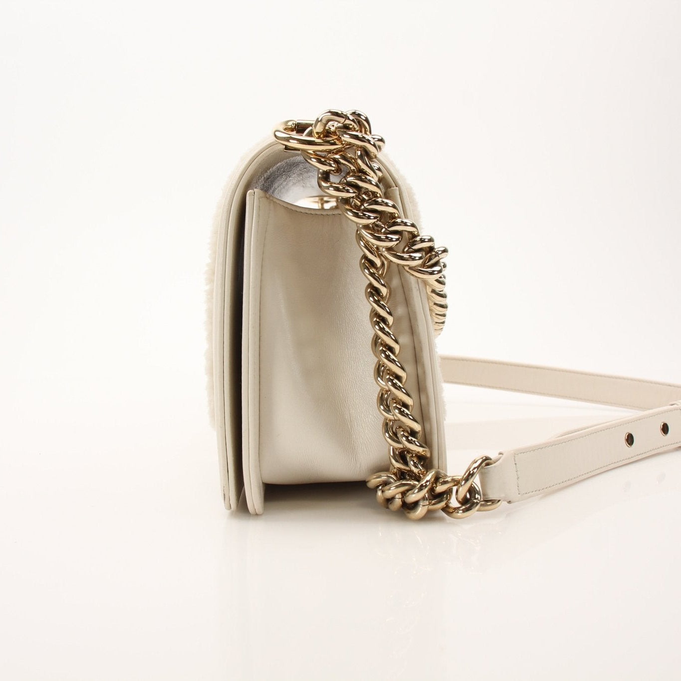 Gold & Beyond Chanel Le Boy Shoulder Bag, stylish handbag with quilted leather and chain strap, displayed on a neutral background.