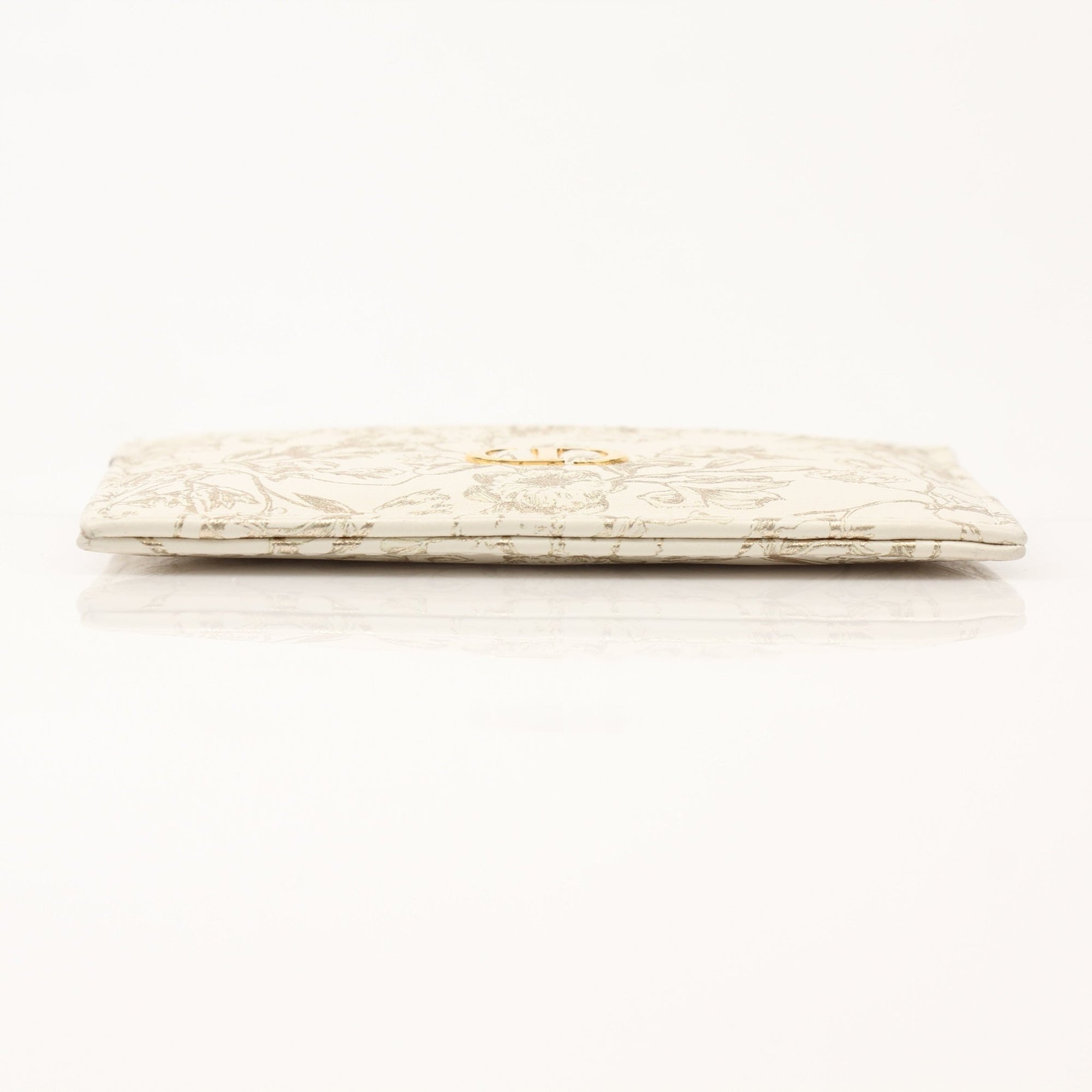 Christian Dior Caro Freesia gold-tone cardholder wallet with multiple card slots and elegant design.