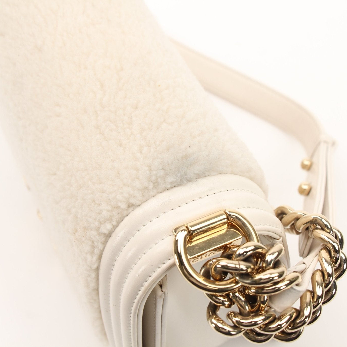 Gold & Beyond Chanel Le Boy Shoulder Bag, stylish handbag with quilted leather and gold-tone hardware, displayed on a neutral background.