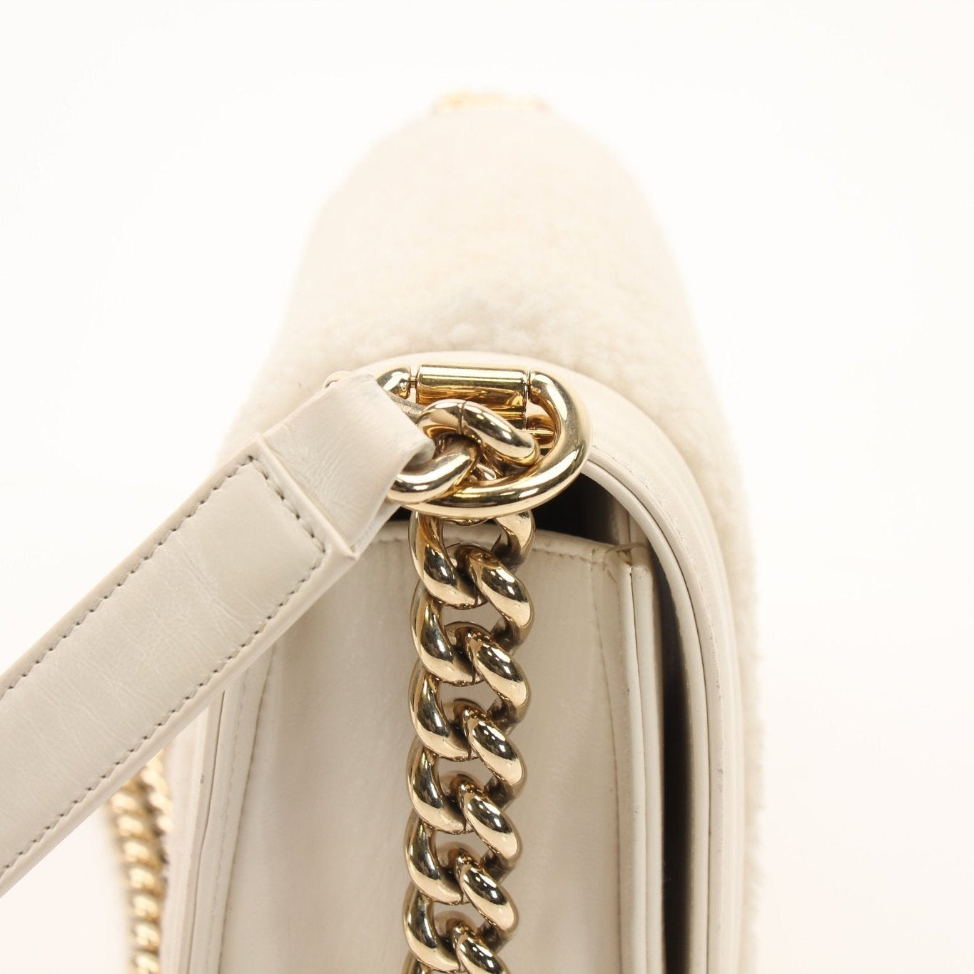 Gold & Beyond Chanel Le Boy shoulder handbag with quilted leather and chain strap, stylish and elegant accessory.