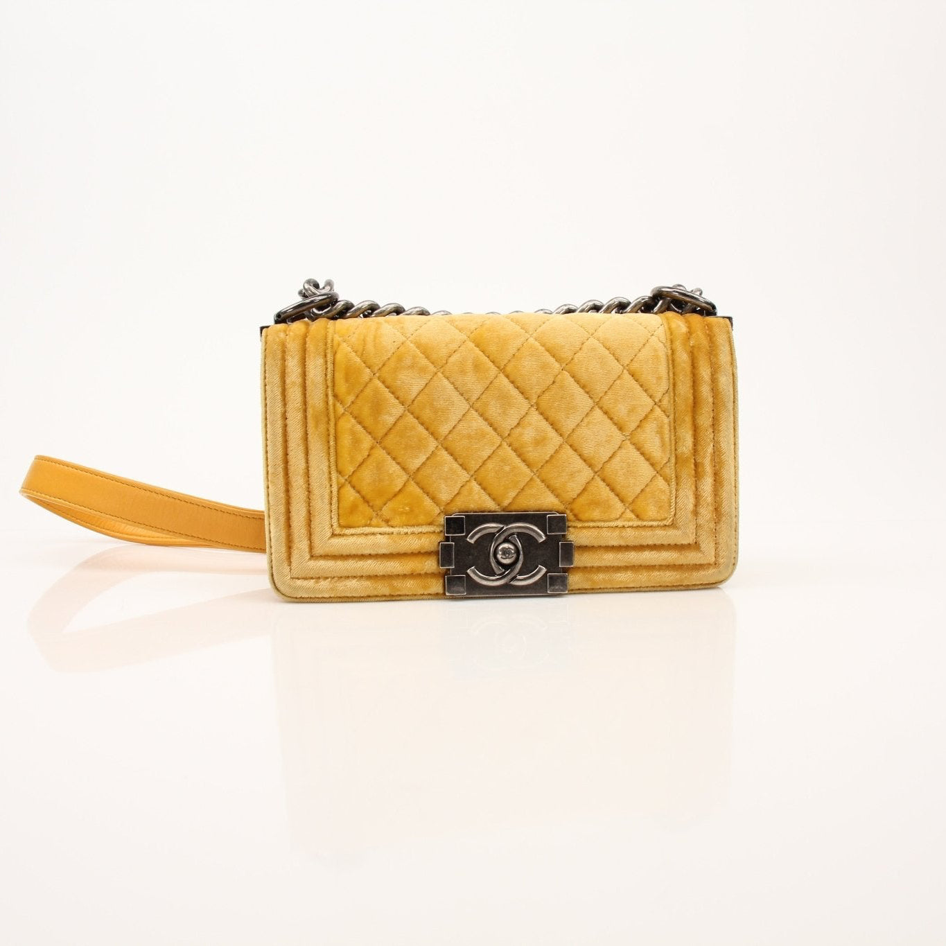 Chanel Small Le Boy Bag in mustard yellow velvet and leather with gold-tone hardware and chain strap, stylish handbag for women