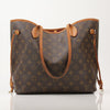 Louis Vuitton Neverfull Monogram Tote handbag with gold accents and adjustable straps, featuring iconic LV monogram canvas.