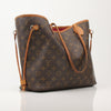Louis Vuitton Neverfull Monogram tote handbag with leather handles and spacious interior, displayed on a neutral background.