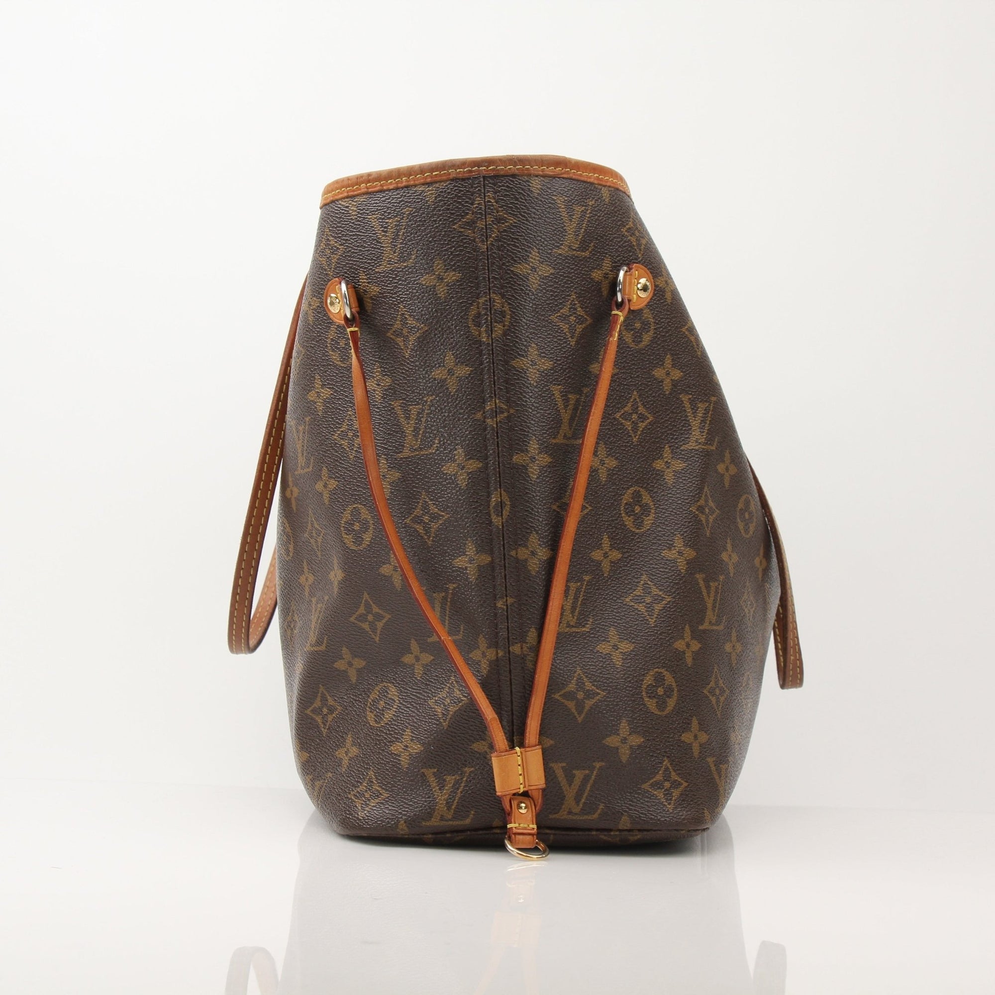Louis Vuitton Neverfull Monogram Tote handbag with gold-tone hardware and spacious interior, featuring the iconic monogram canvas.