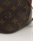 Louis Vuitton Neverfull Monogram tote handbag with gold accents, displayed on a neutral background.