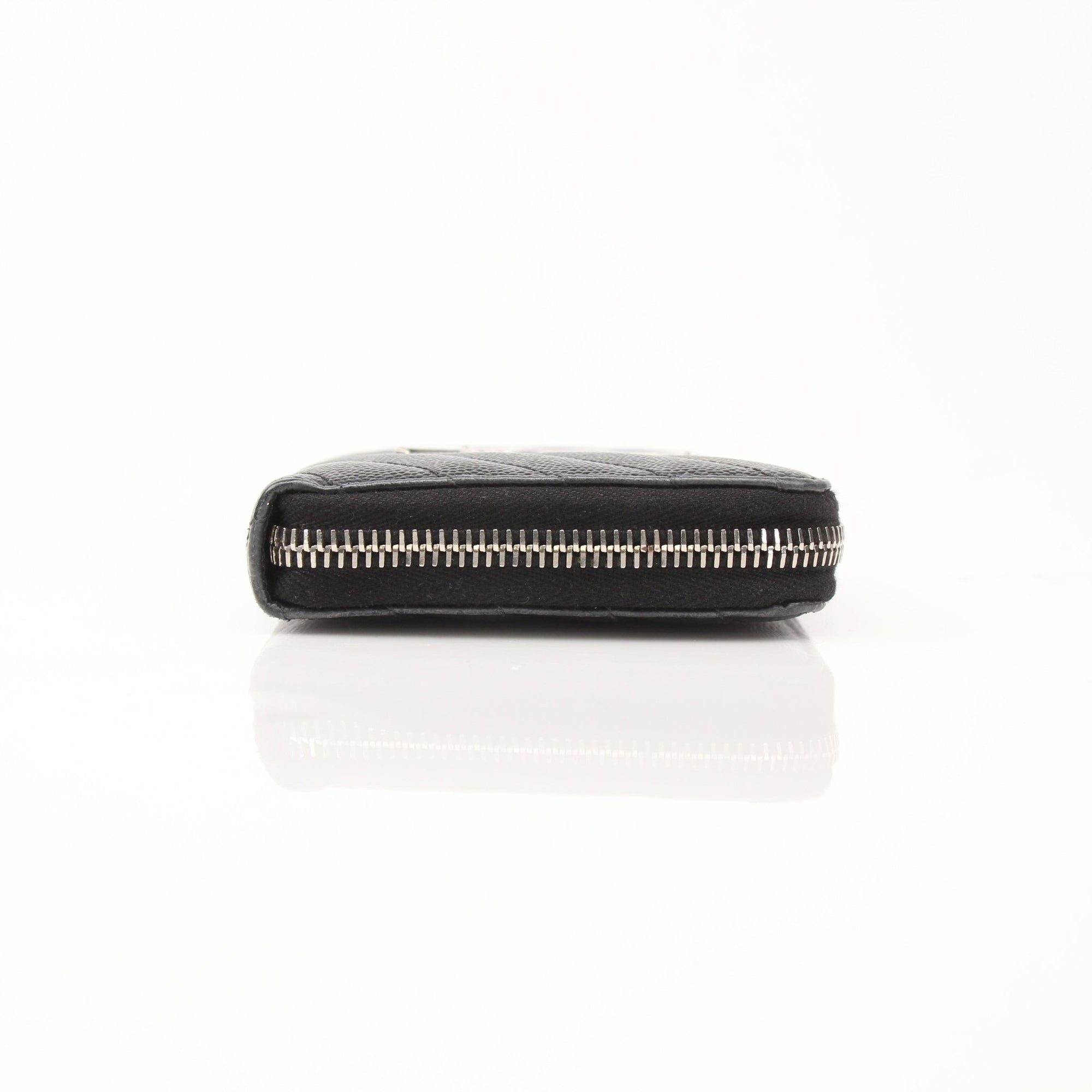 Yves Saint Laurent Chevron Wallet in black leather with a quilted chevron pattern and gold-tone hardware.