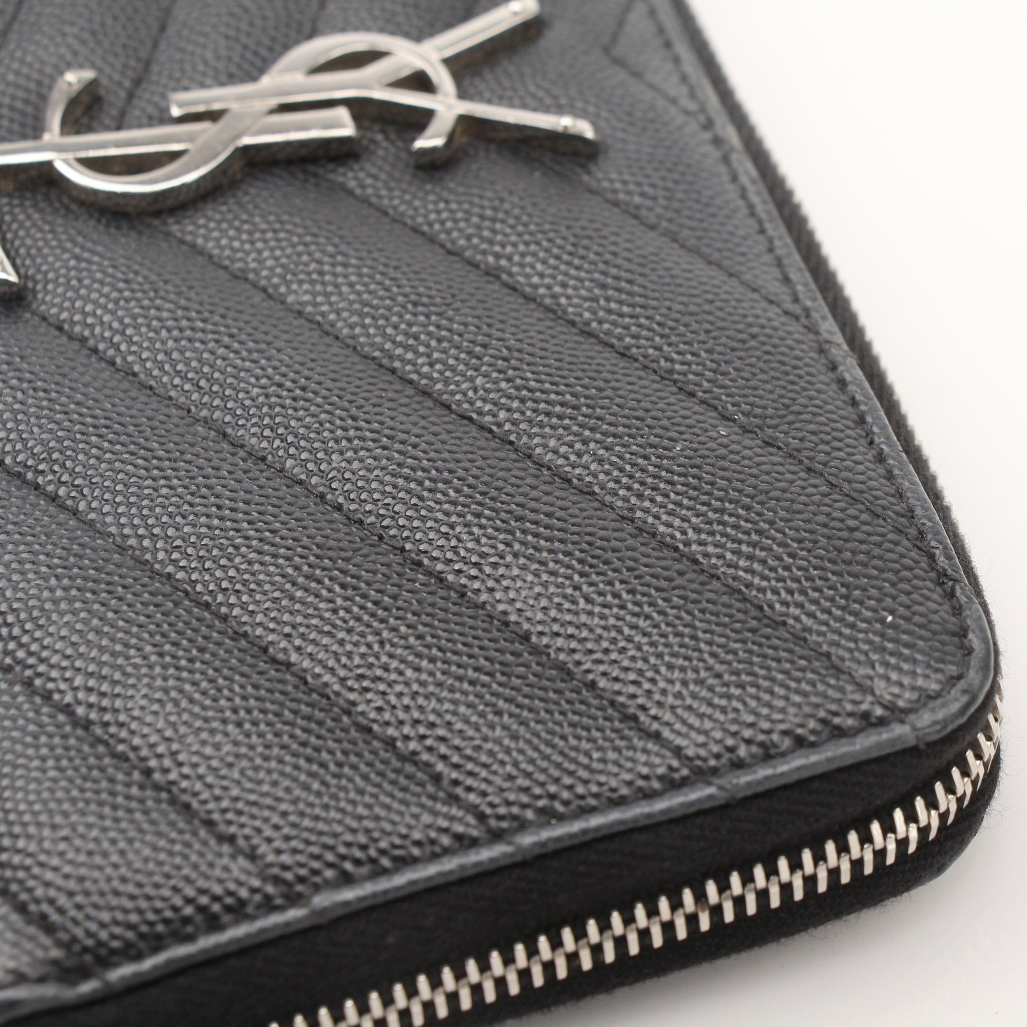 Yves Saint Laurent Chevron Wallet in black leather with a chevron pattern and gold-tone YSL logo.