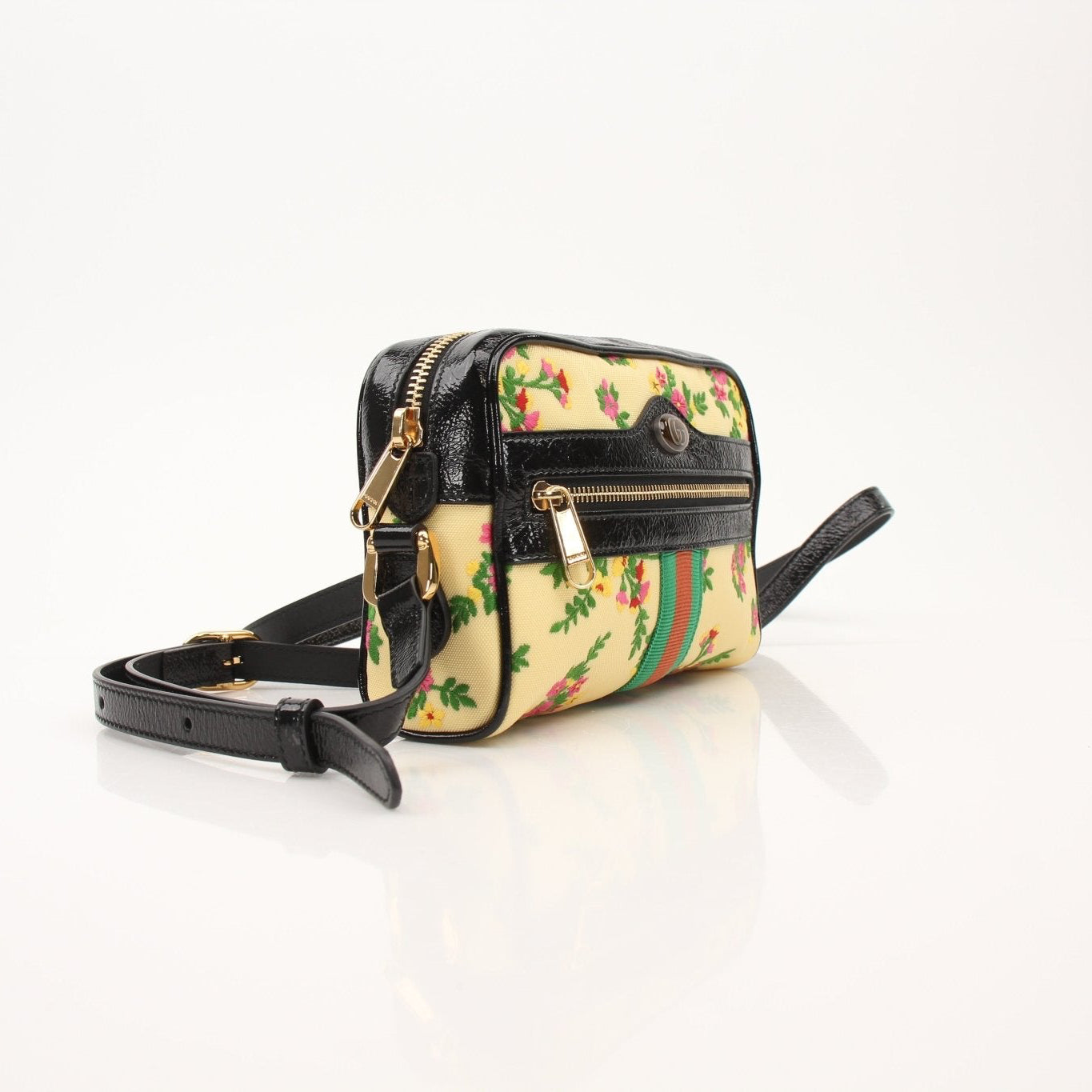 Gucci Ophidia floral crossbody handbag with signature design and colorful pattern, featuring a compact, stylish accessory for everyday use.