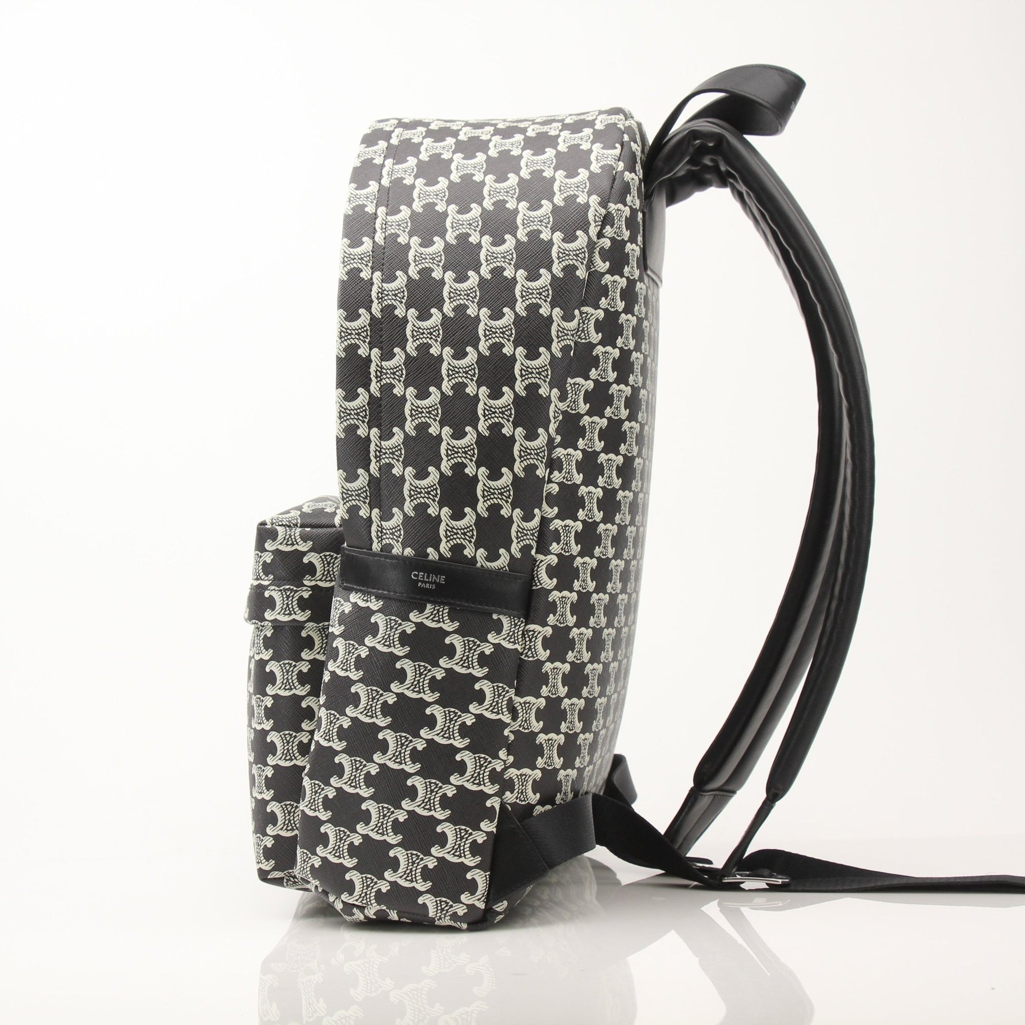 Gold & Beyond Celine Triomphe Canvas Backpack, travel bag with adjustable straps and logo detail, on a plain background.