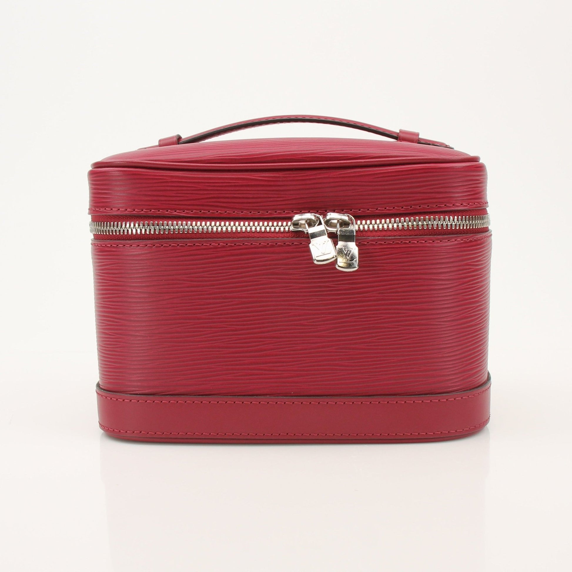 Gold & Beyond Louis Vuitton Nice Vanity Case with leather handle and gold hardware, resting on a surface.