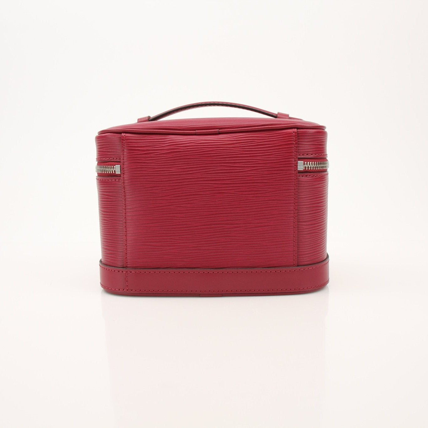 Gold & Beyond Louis Vuitton Nice Vanity Case with leather handle and gold accents, showcasing elegant travel accessory design.