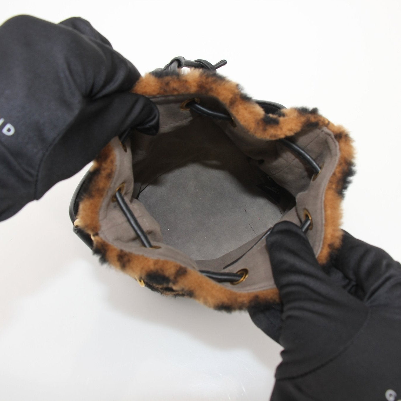 Gold & Beyond Fendi Macro Bucket Handbag with leather strap and logo detail, stylish accessory for everyday use.