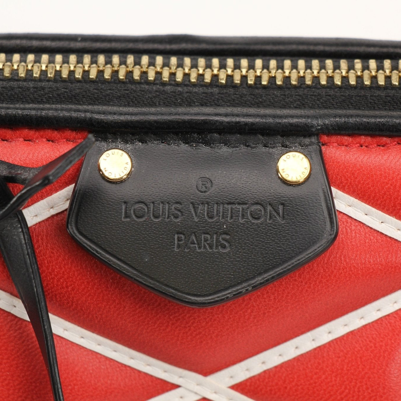 Louis Vuitton Alma PM satchel handbag with gold hardware and structured design, featuring textured leather and top handles.