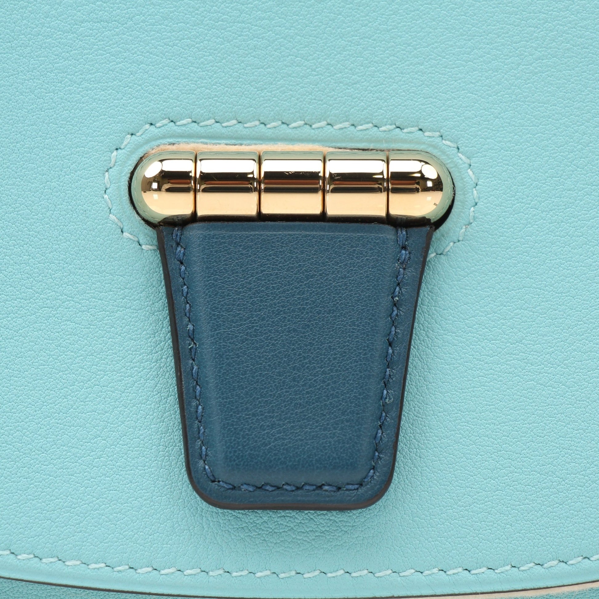 Hermès Convoyeur handbag by Gold & Beyond, showcasing the elegant leather design with gold-tone hardware and stylish shoulder strap.