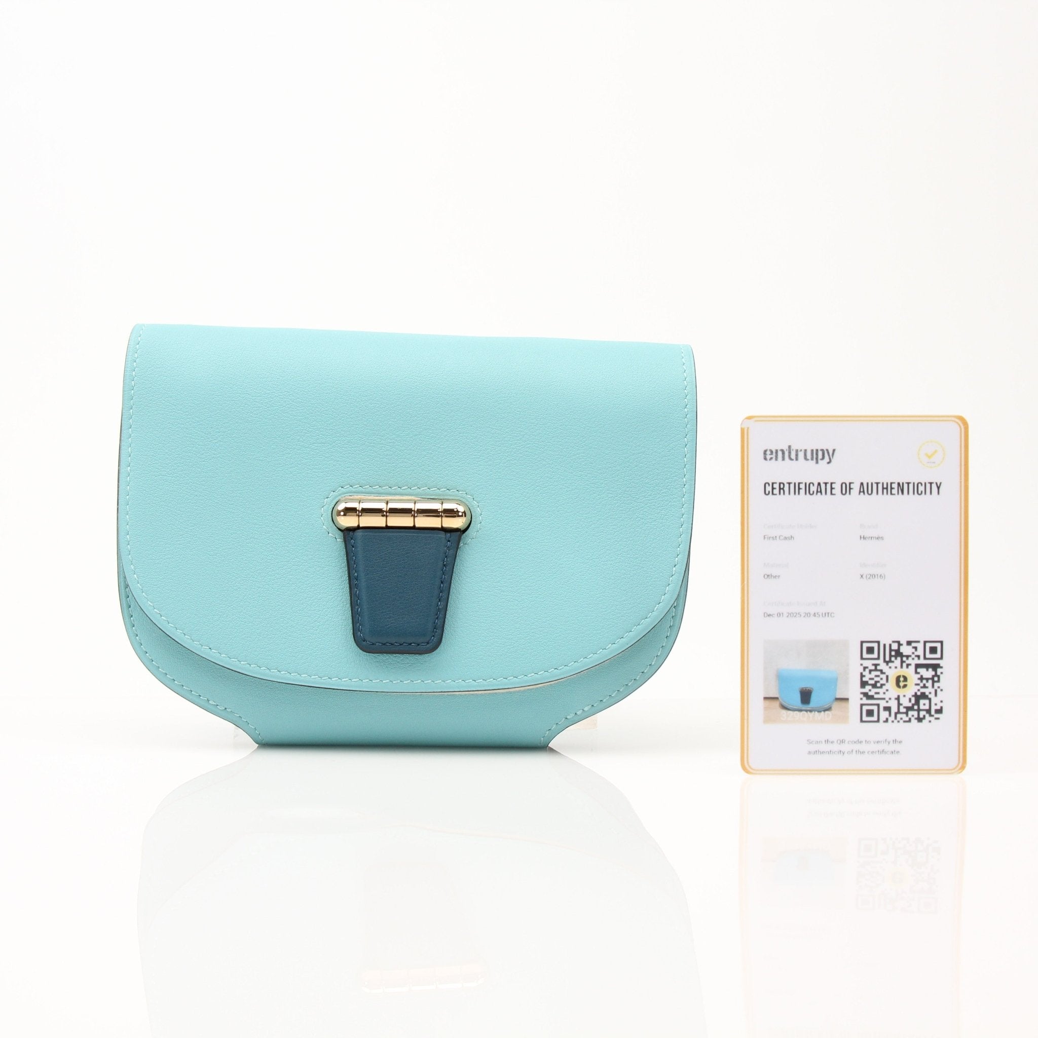 Hermès Convoyeur handbag in tan leather with gold hardware, featuring a structured design and top handle.