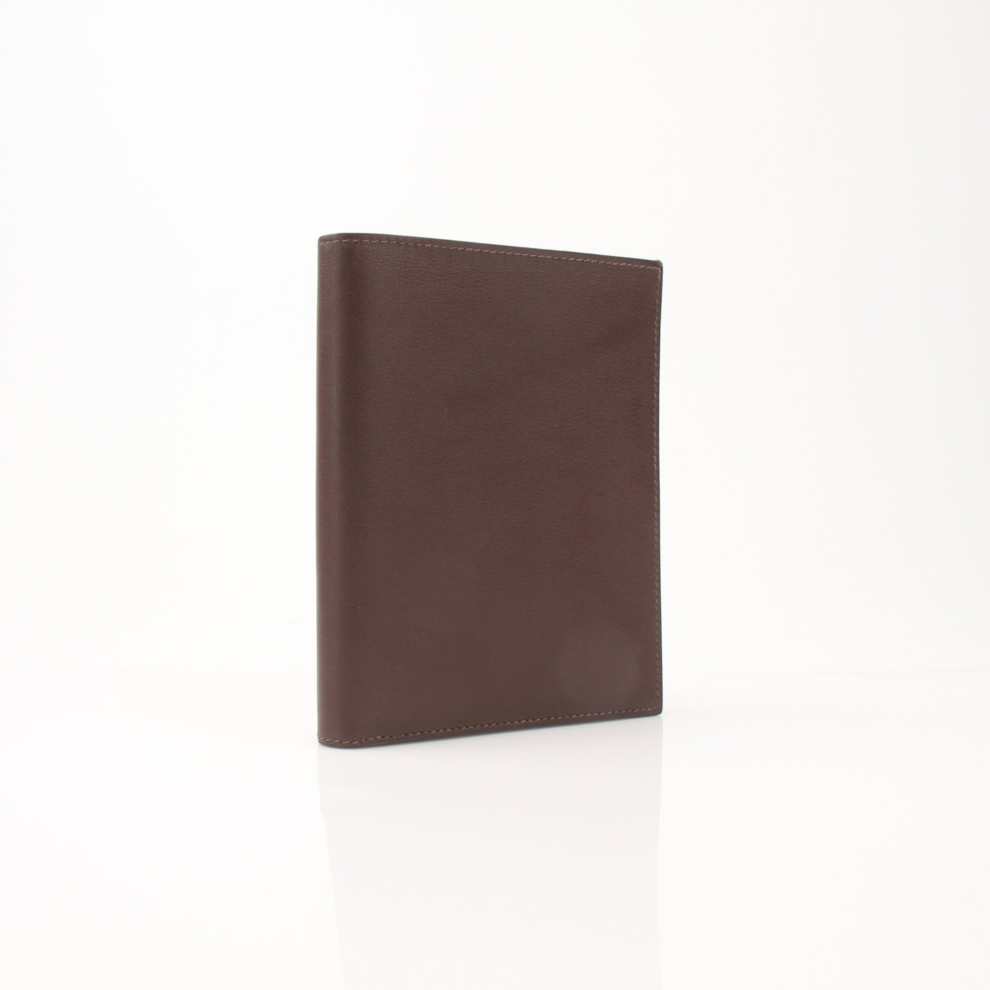 Hermès leather wallet by Gold & Beyond, showcasing its sleek brown leather exterior and compact design with card slots.