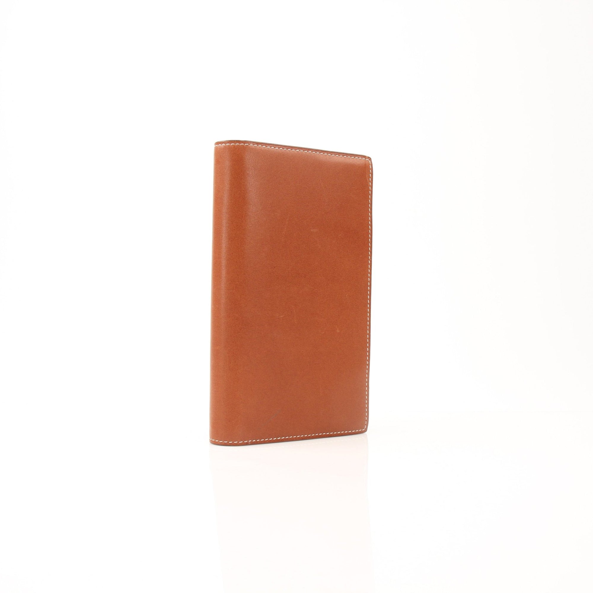 Gold & Beyond Hermès vintage notebook cover accessory with textured leather and elegant design, perfect for stylish note-taking.