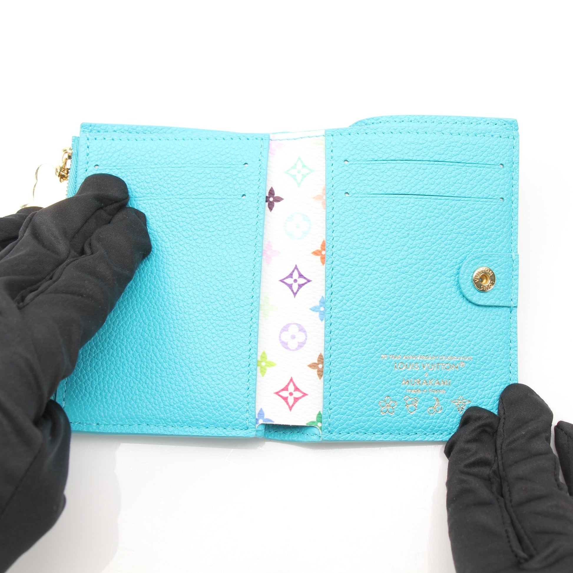 Louis Vuitton x Takashi Murakami compact wallet by Gold & Beyond, featuring colorful floral design and gold-tone accents.