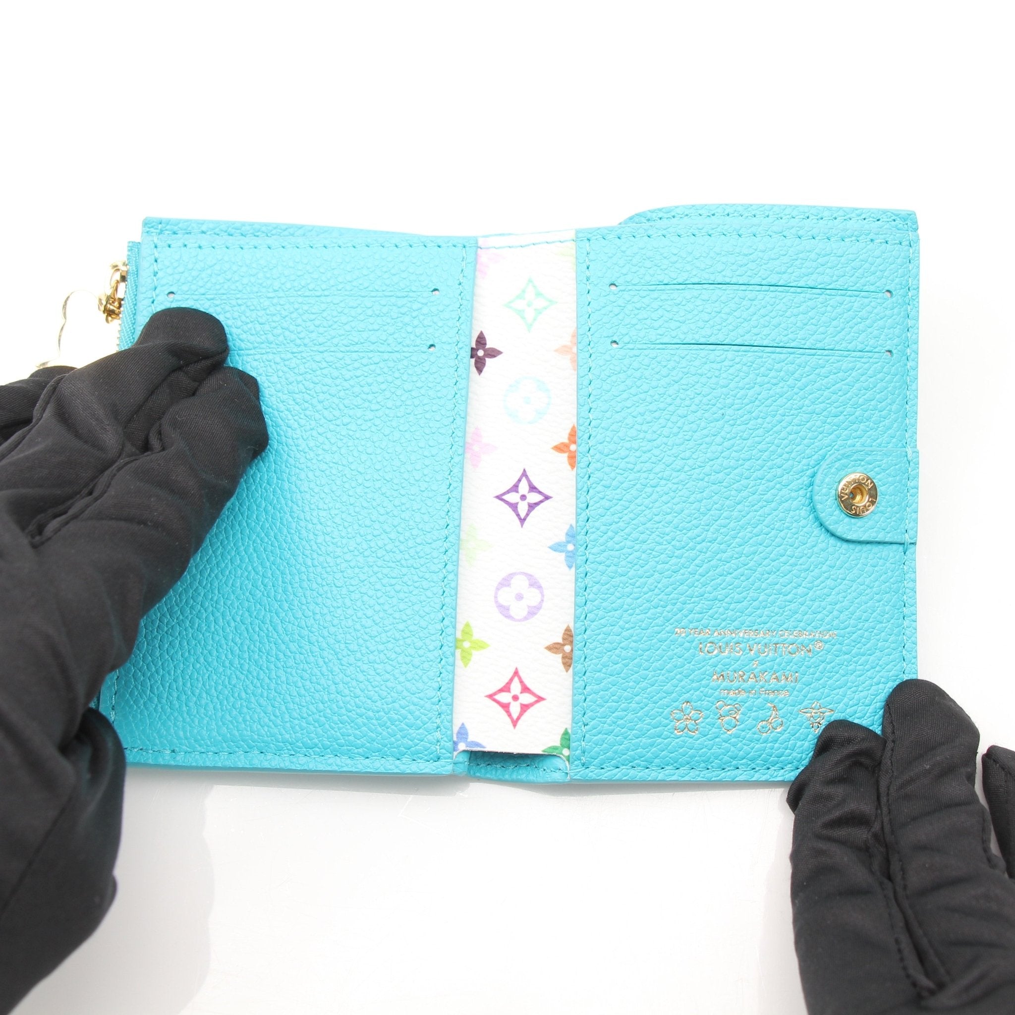 Louis Vuitton x Takashi Murakami compact wallet by Gold & Beyond, featuring colorful floral design and gold-tone accents.